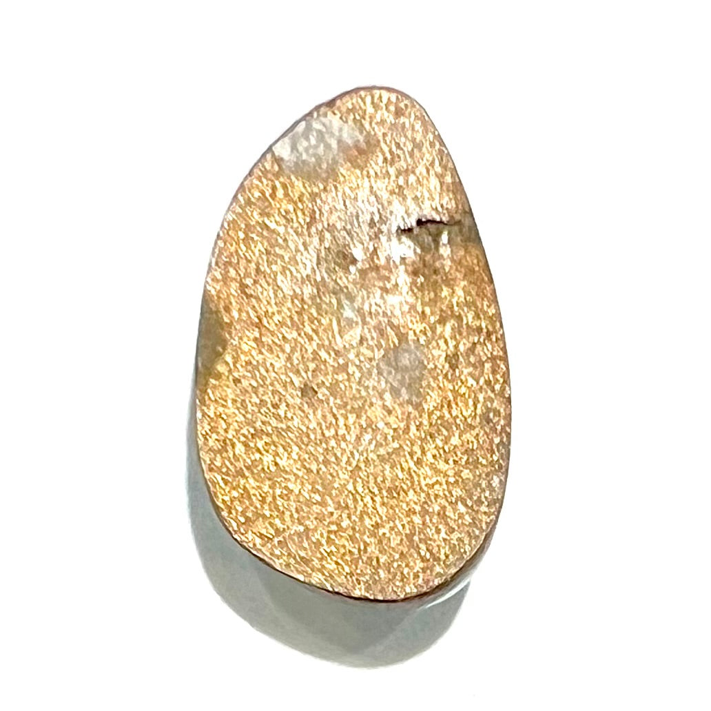 A light blue turquoise stone from Sleeping Beauty Mine, Arizona. The stone is backed with opticon.