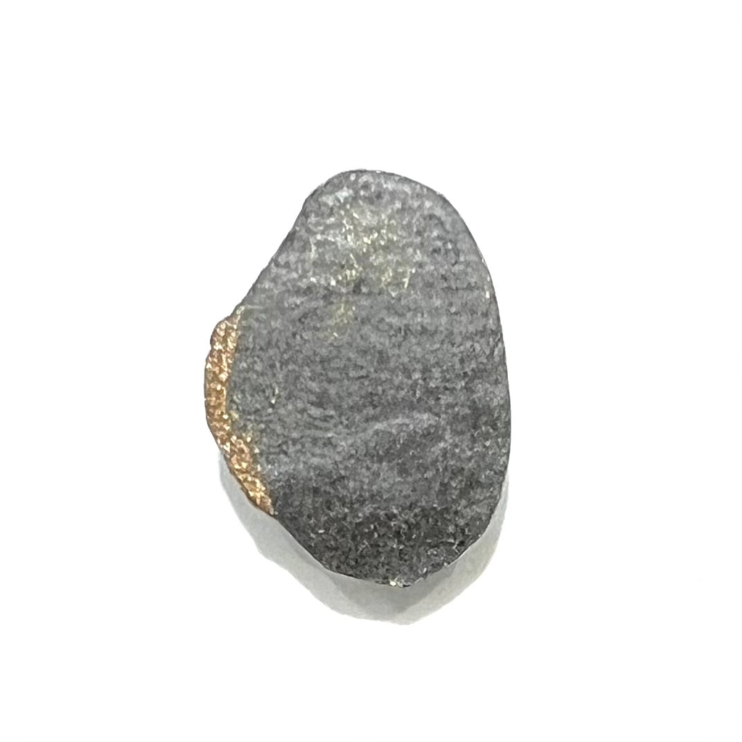 A loose, freeform cut Pilot Mountain turquoise cabochon. The stone is greenish blue.