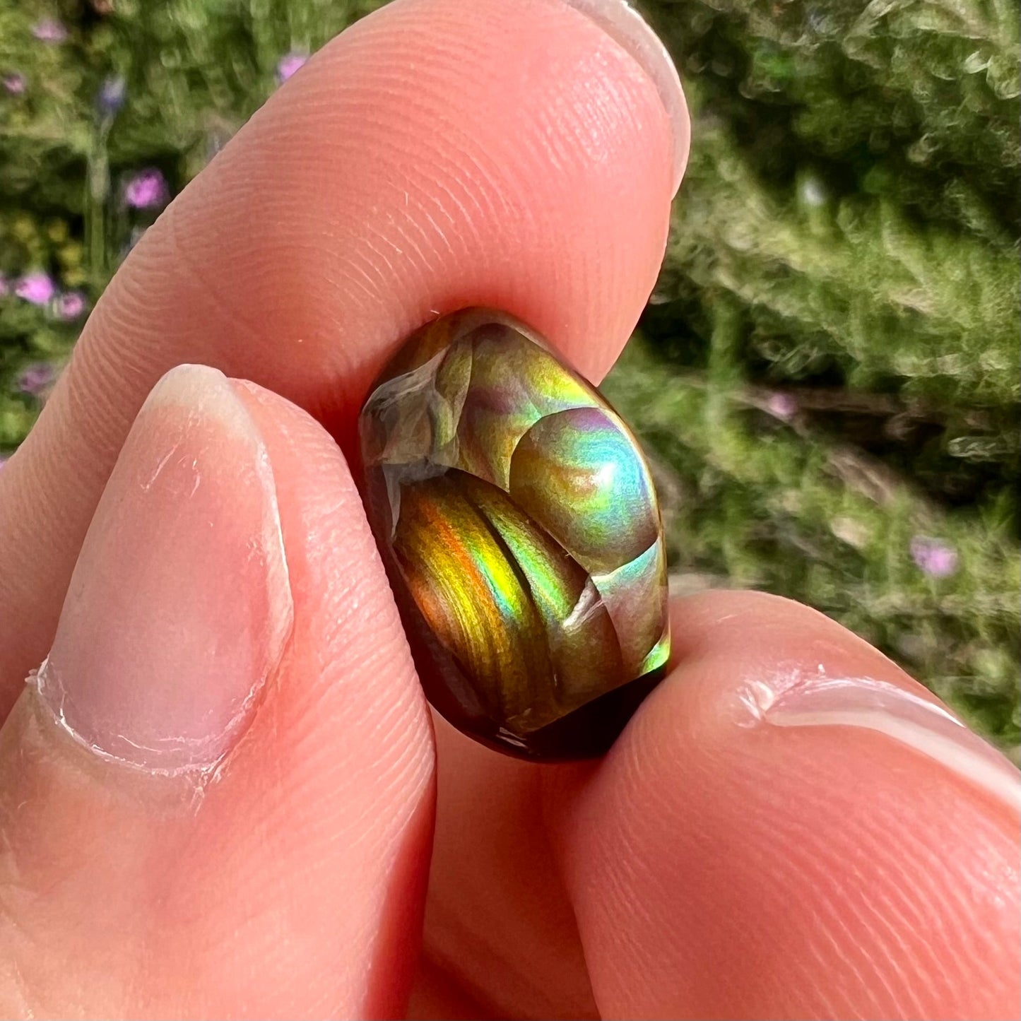 A loose, gem grade Mexican fire agate stone.  The stone is finely banded and ice blue green color.