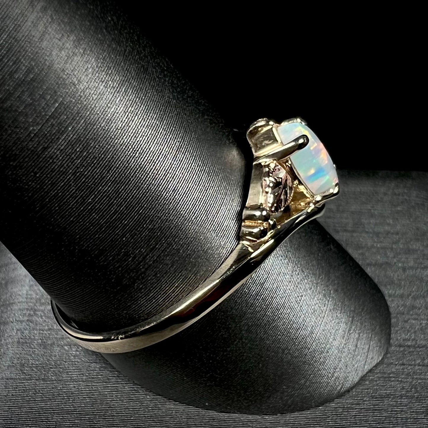 A vintage Blach Hills gold ring mounted with a marquise cut lab created opal.