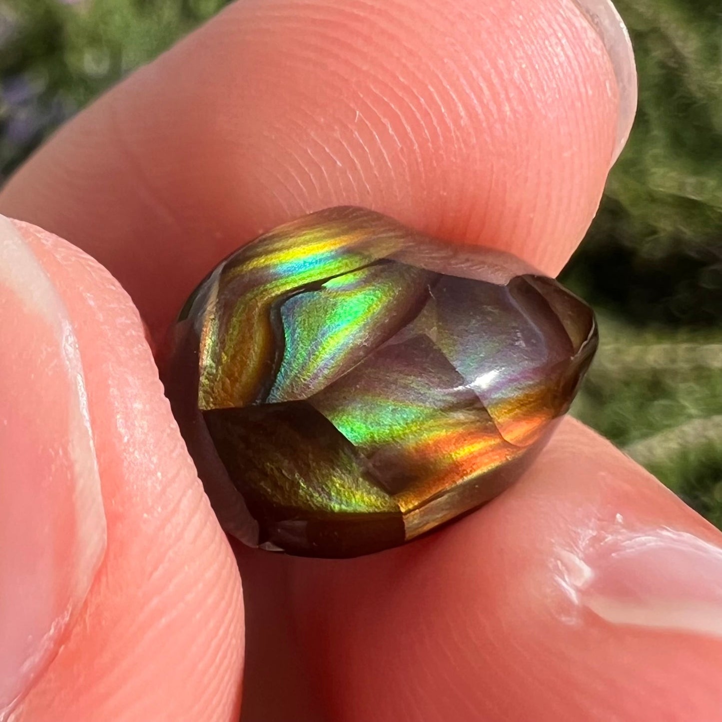 A loose, gem grade Mexican fire agate stone.  The stone is finely banded and ice blue green color.
