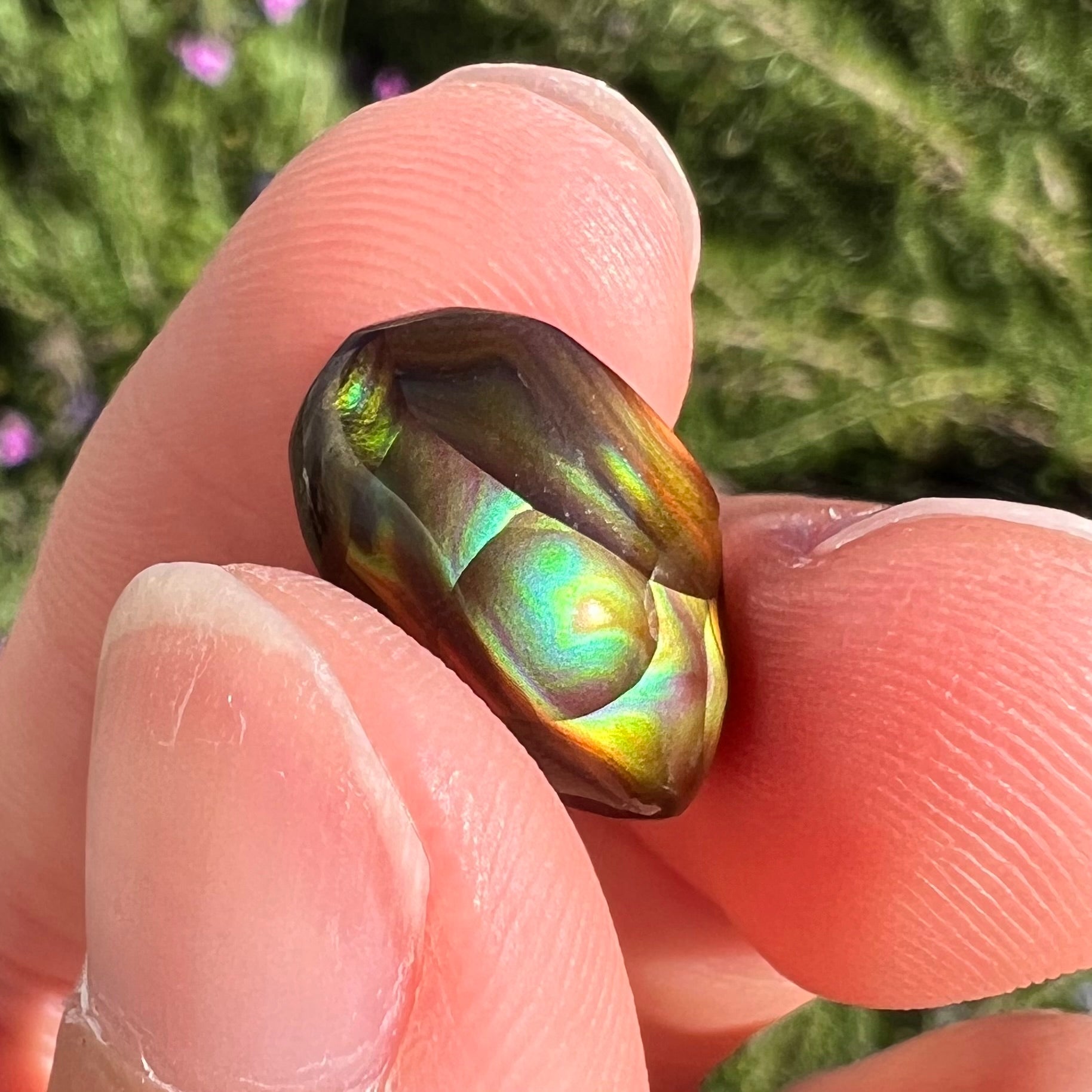A loose, gem grade Mexican fire agate stone.  The stone is finely banded and ice blue green color.
