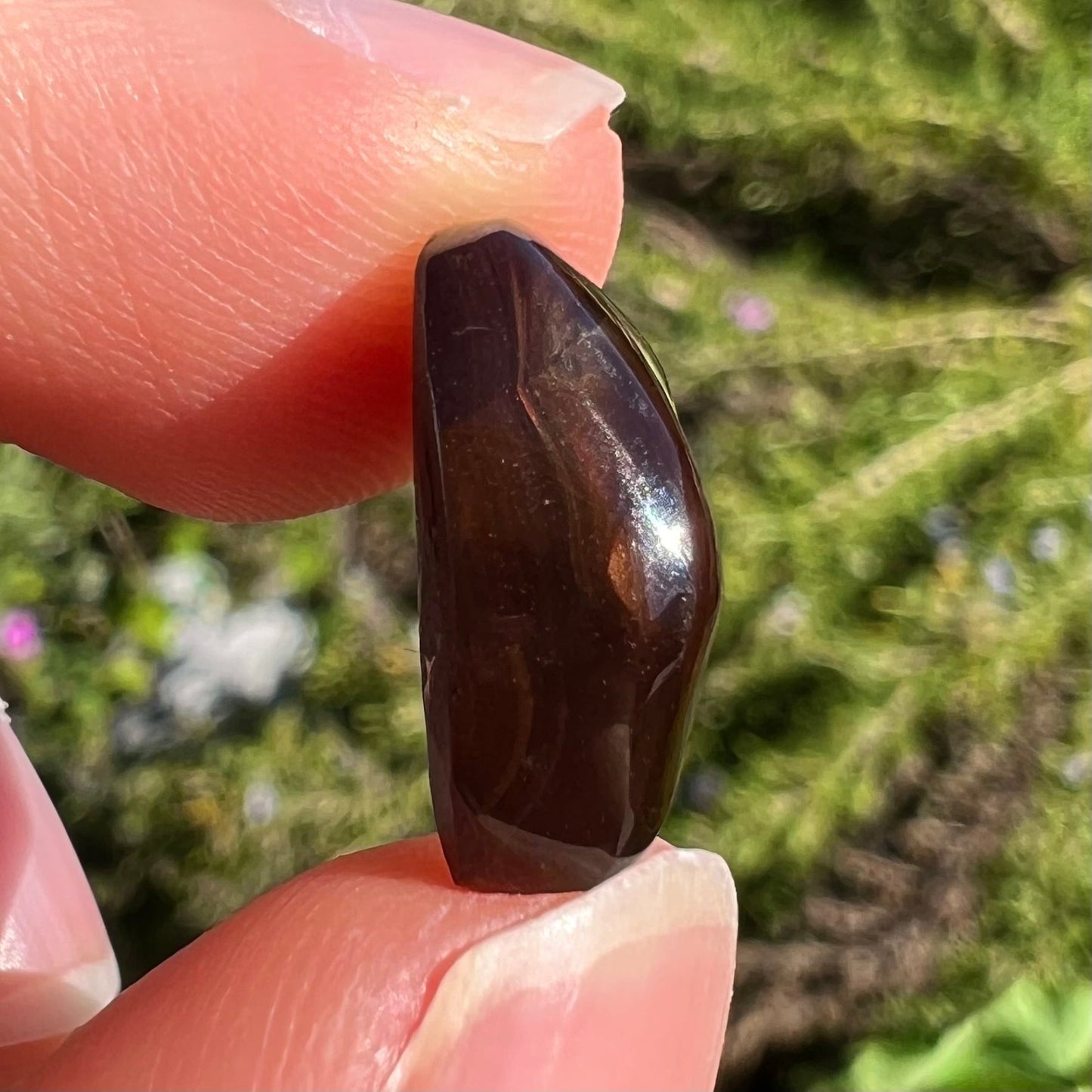 A loose, gem grade Mexican fire agate stone.  The stone is finely banded and ice blue green color.