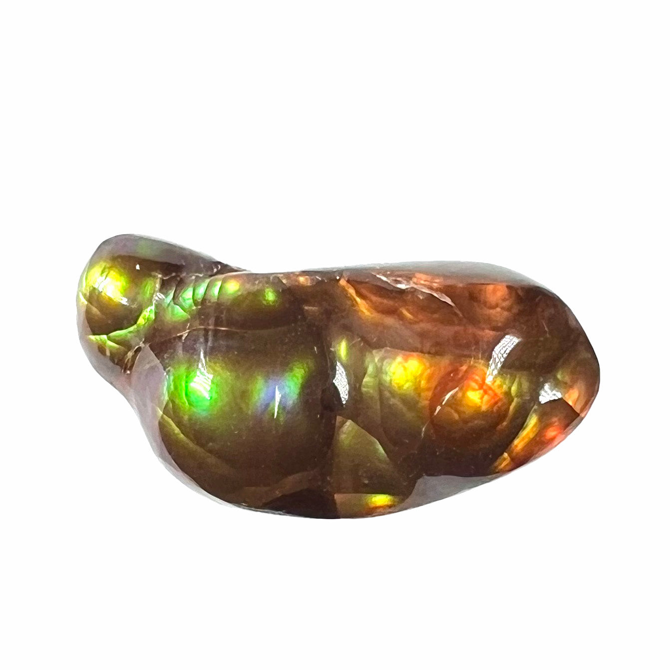 A loose, freeform shaped fire agate stone. The fire agate has red, orange, and yellow colors on one side, and the other has green and blue colors.