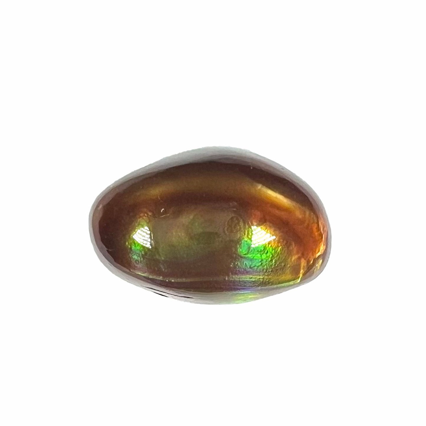 A loose, oval cabochon cut fire agate stone that shines red, yellow, green, blue, and purple.