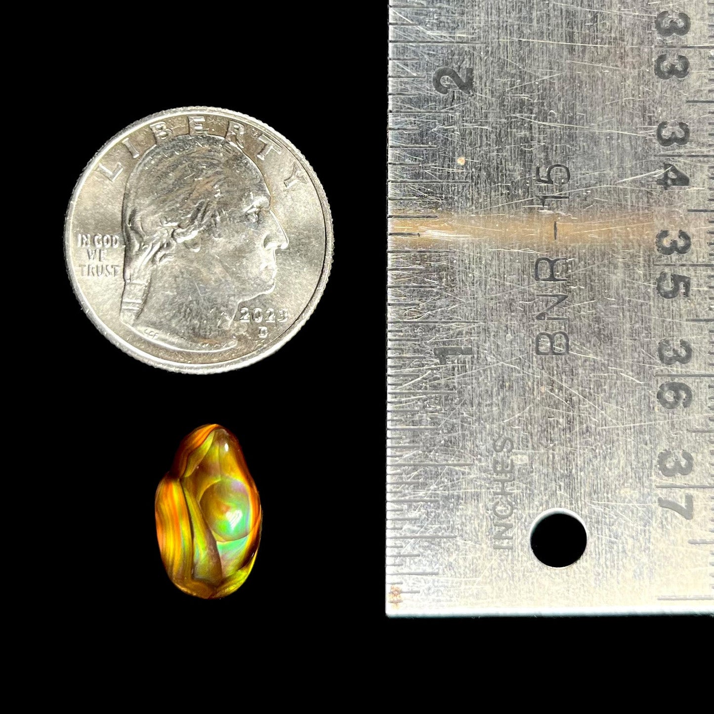 A loose, gem grade Mexican fire agate stone.  The stone is finely banded and ice blue green color.