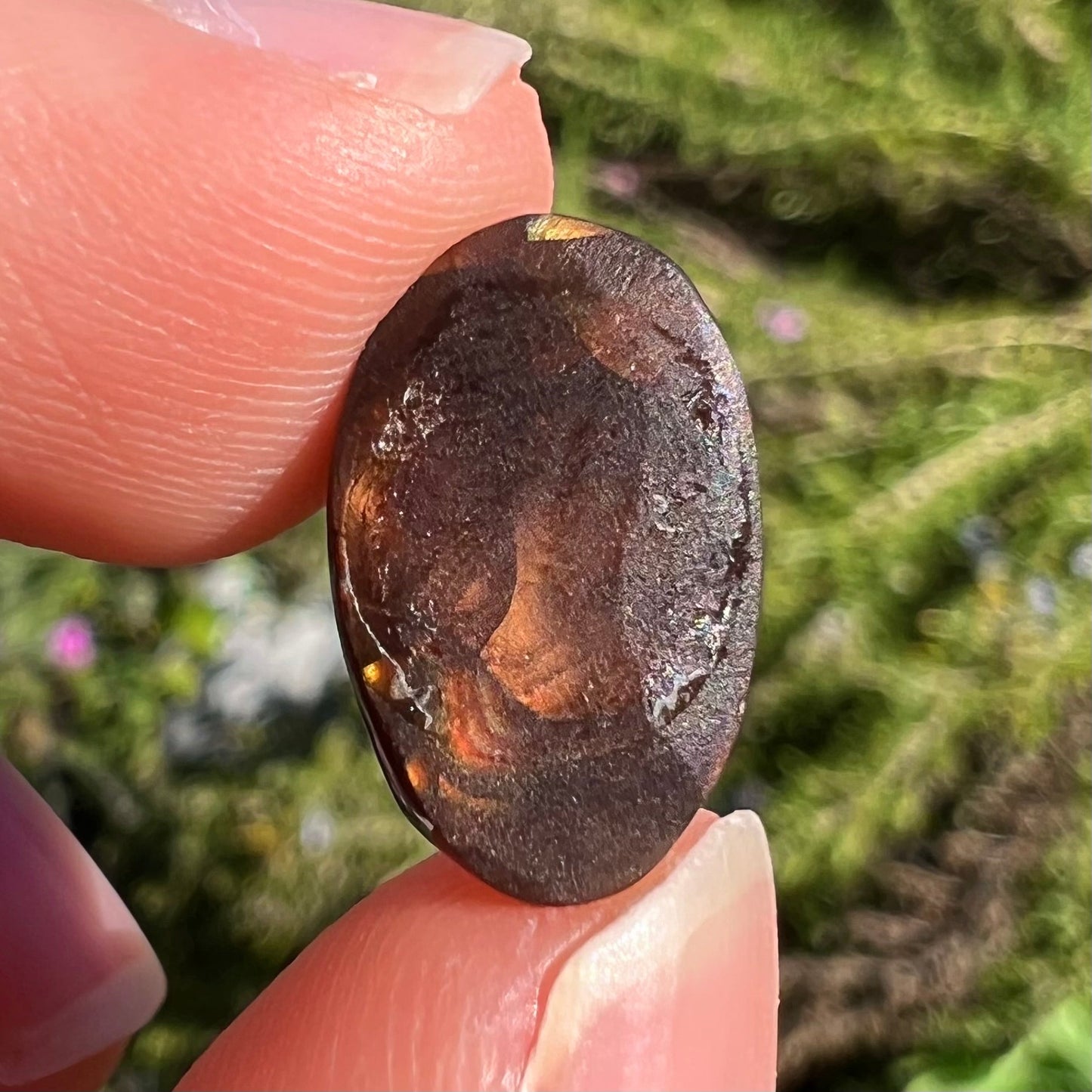 A loose, gem grade Mexican fire agate stone.  The stone is finely banded and ice blue green color.