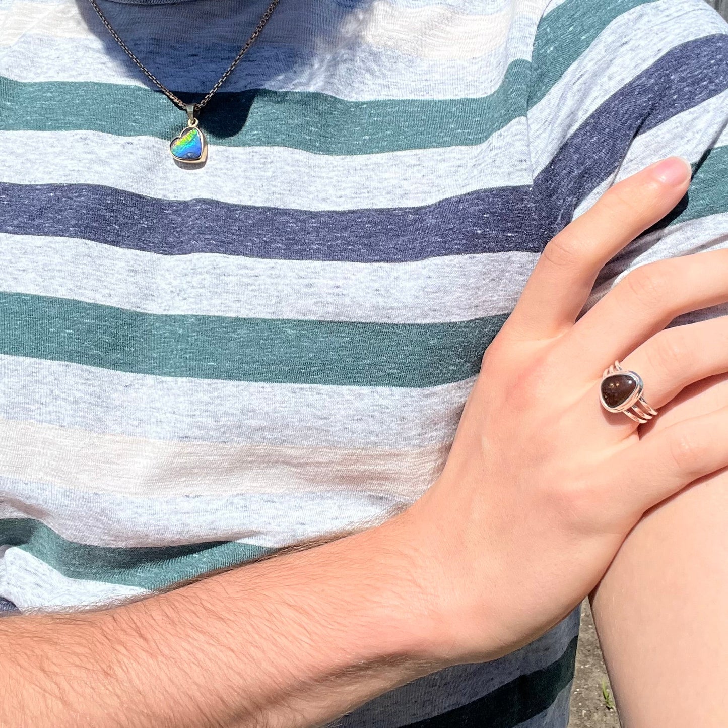 A ladies' freeform cabochon cut fire agate ring in sterling silver.