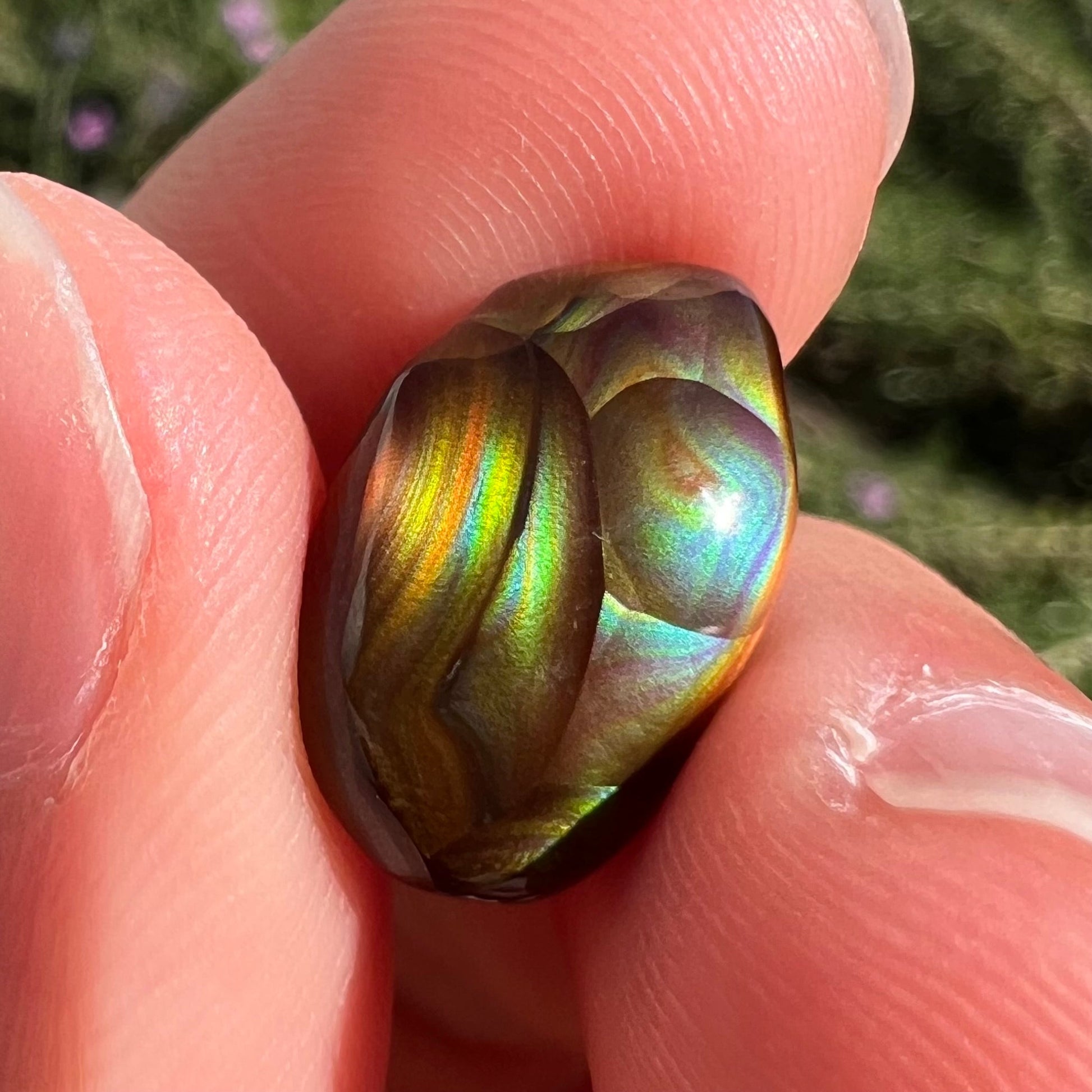 A loose, gem grade Mexican fire agate stone.  The stone is finely banded and ice blue green color.