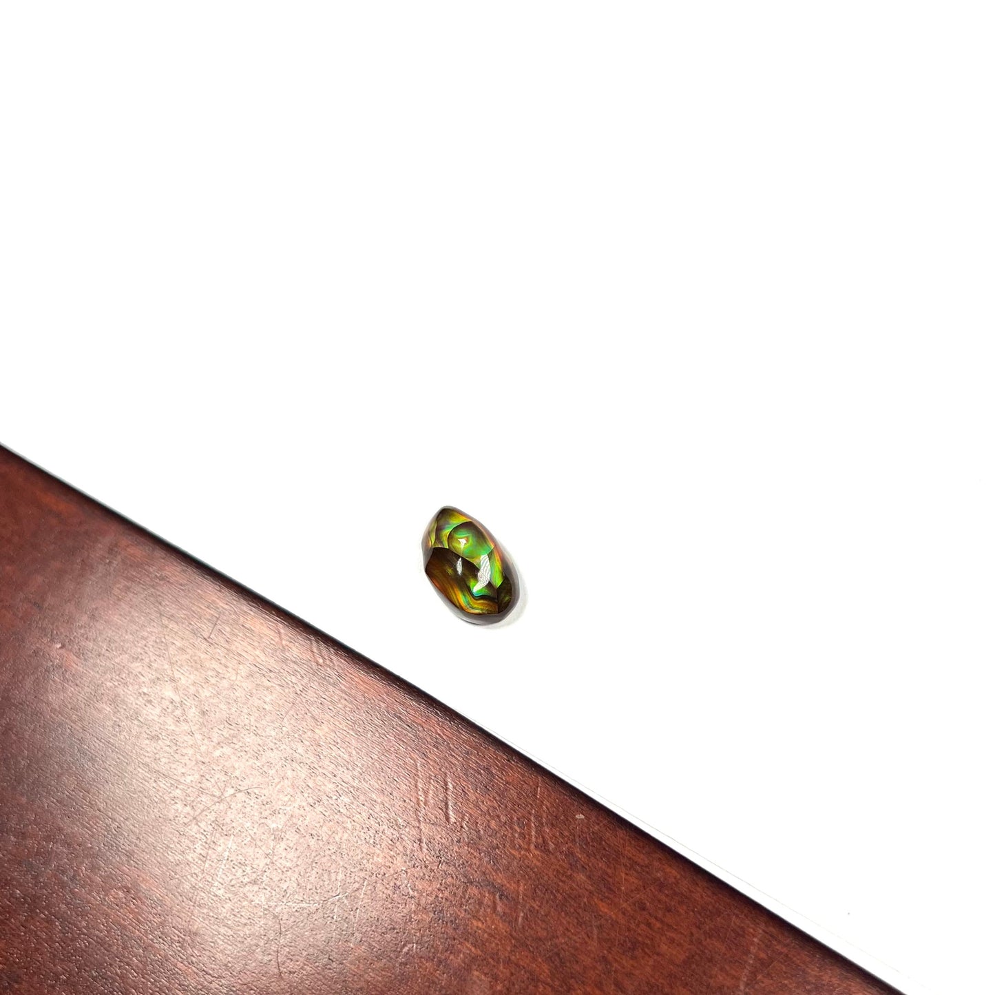 A loose, gem grade Mexican fire agate stone.  The stone is finely banded and ice blue green color.
