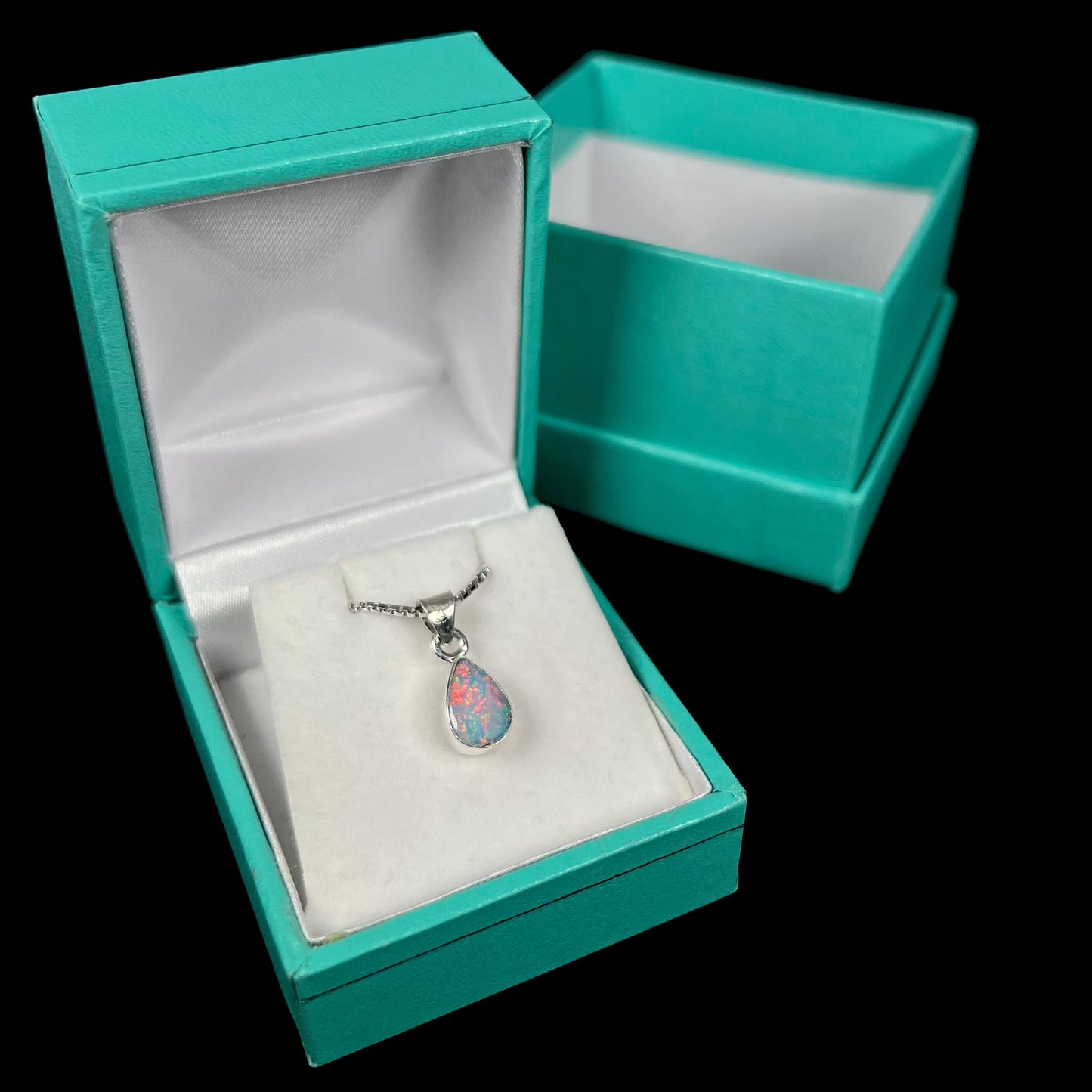 A pear shaped natural crystal opal necklace handmade in sterling silver.