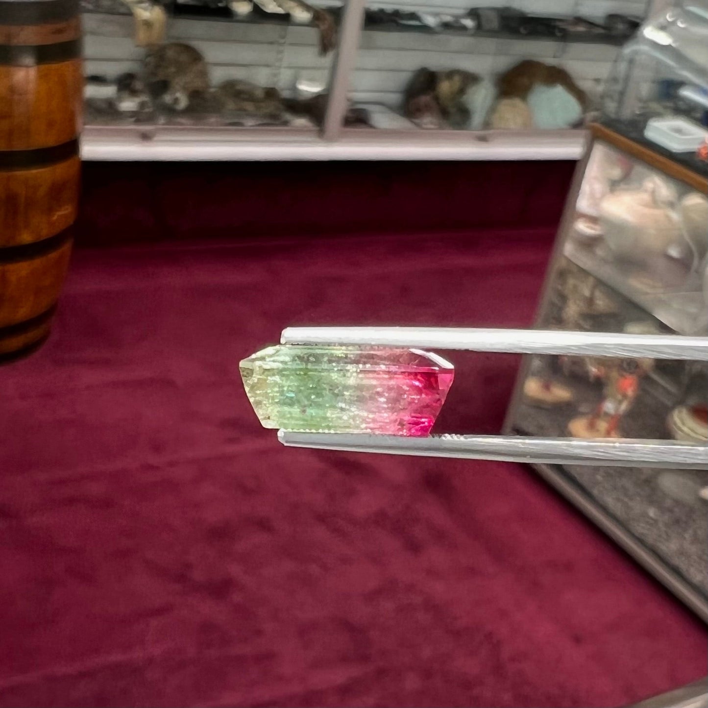 A loose pink and green emerald cut watermelon tourmaline gemstone.