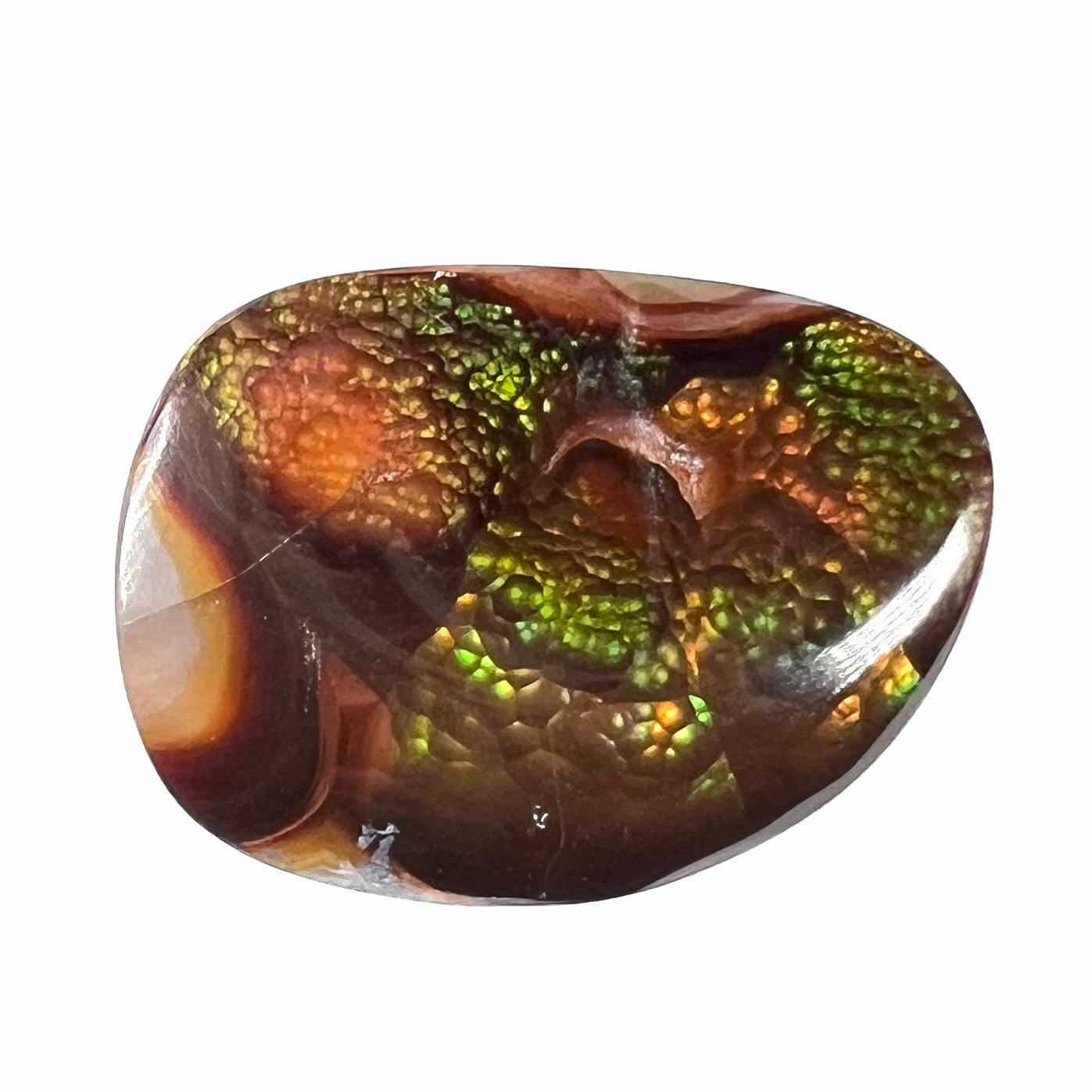 A large Mexican fire agate cabochon. The stone has a bubbly green pattern.