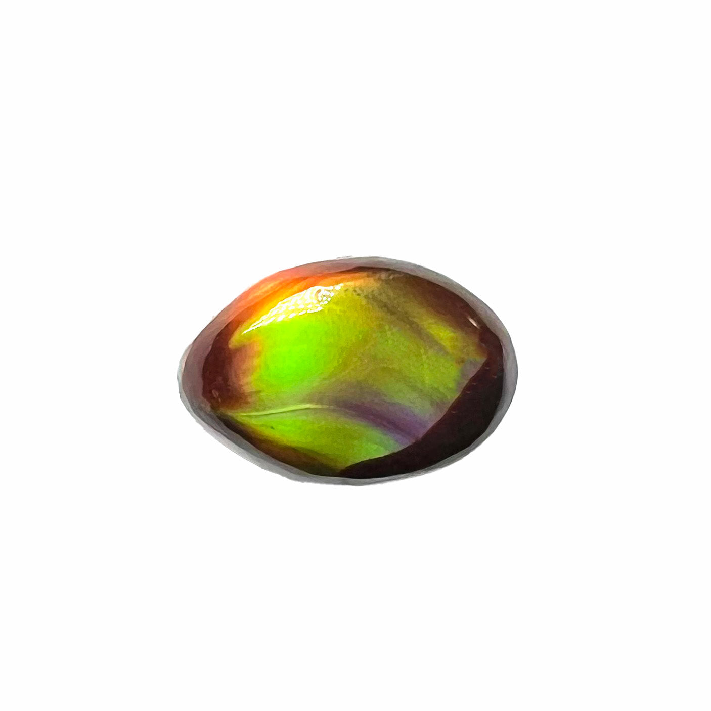 A loose, 3.38ct, pear shaped Mexican fire agate stone.  The stone shines a vivid, bright green color with a purple streak.