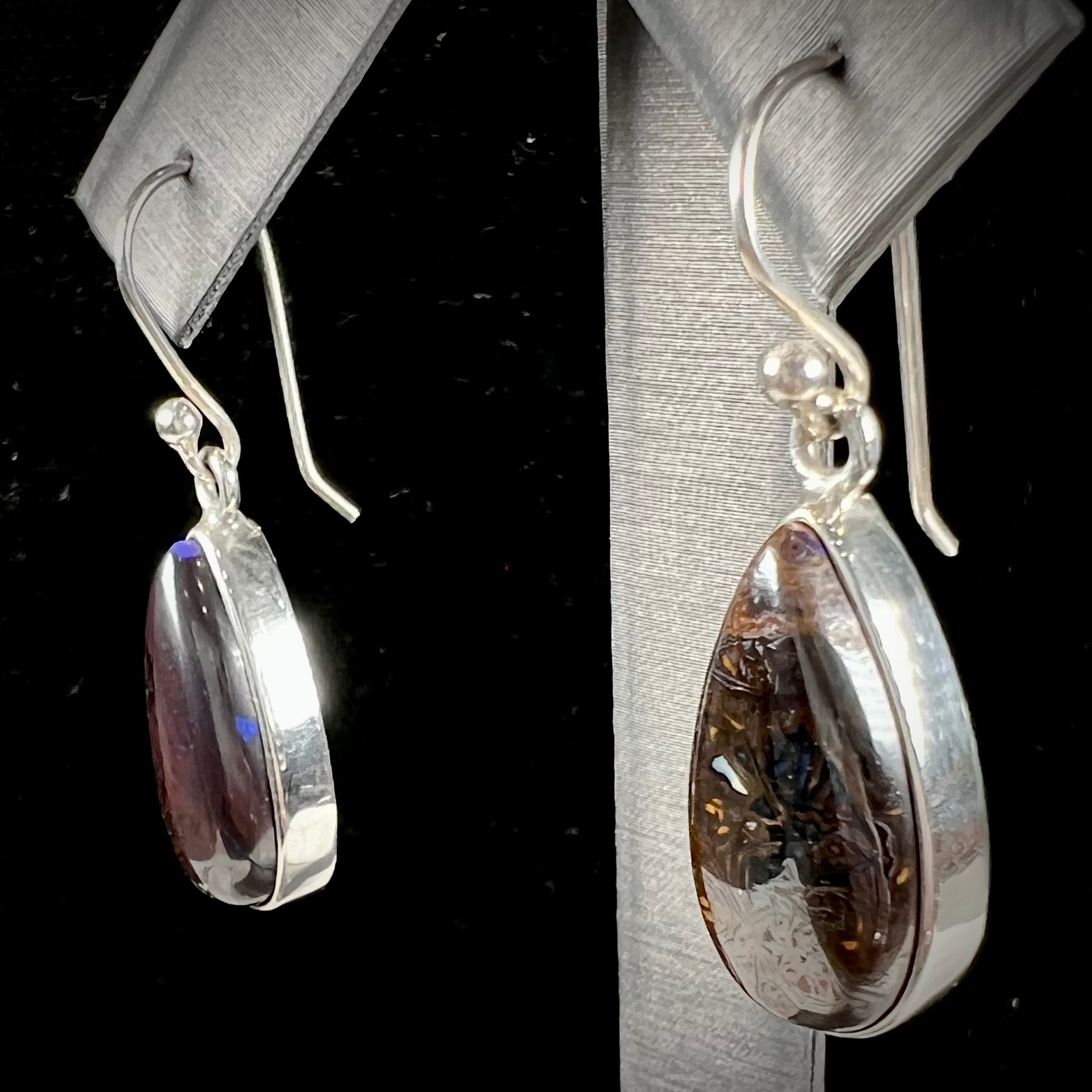 A pair of handmade sterling silver boulder opal French wire dangle earrings.  We named them Ryan and Harris.