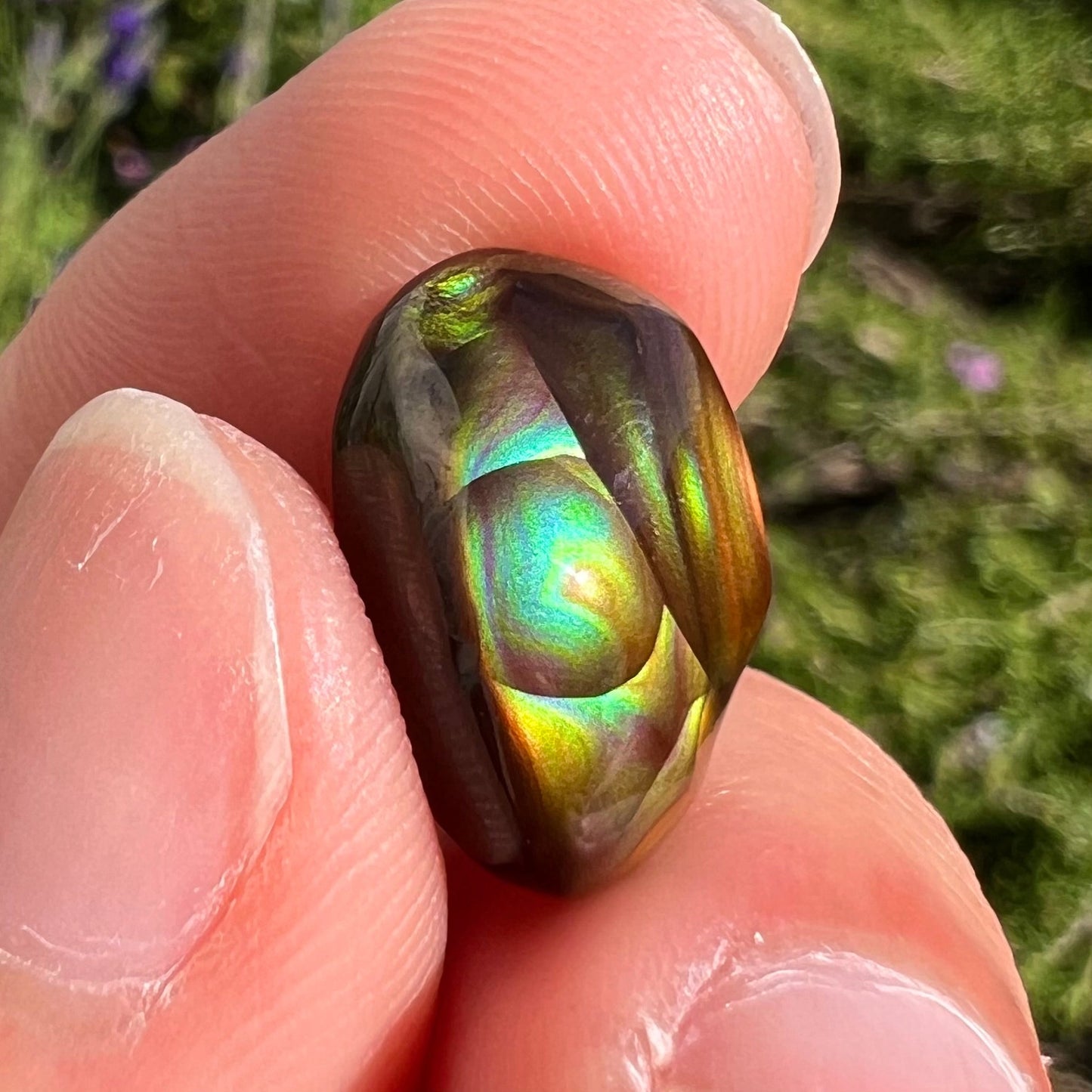 A loose, gem grade Mexican fire agate stone.  The stone is finely banded and ice blue green color.