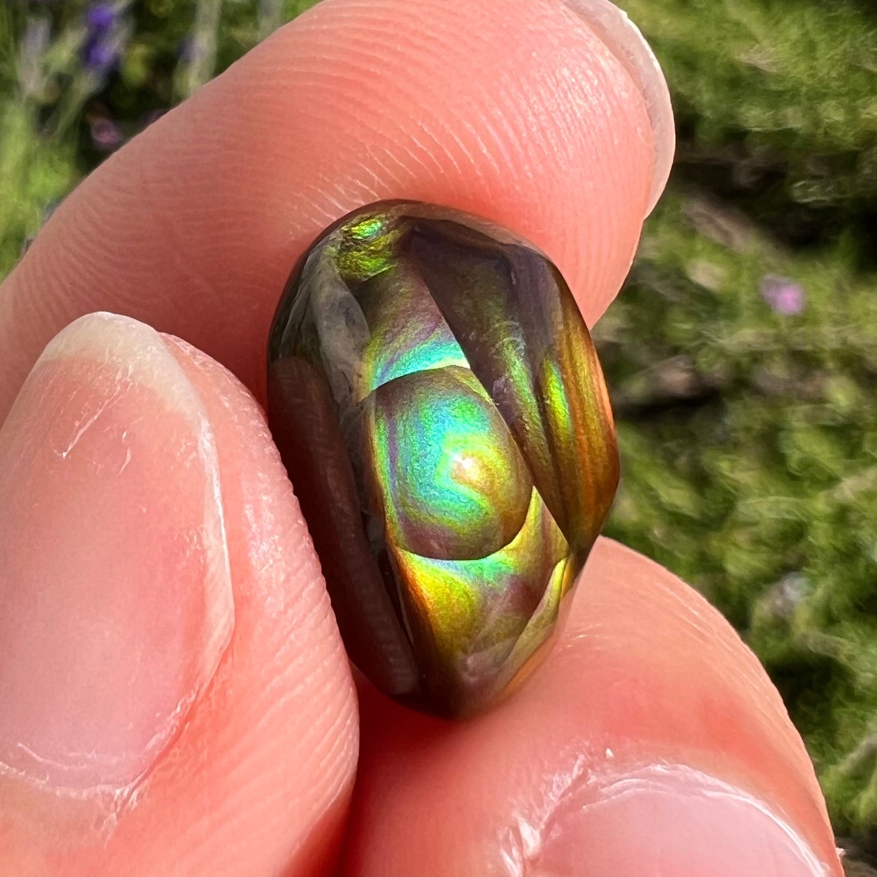 A loose, gem grade Mexican fire agate stone.  The stone is finely banded and ice blue green color.