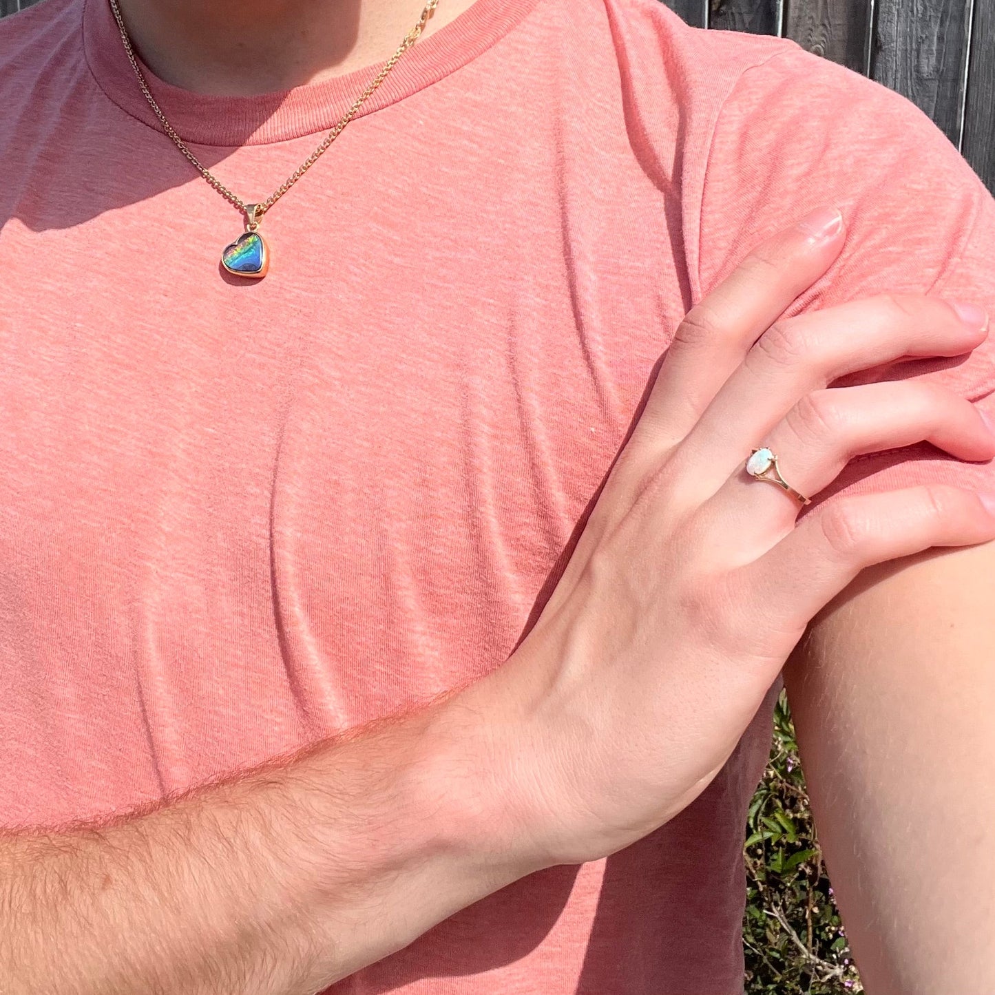 A ladies' simple opal solitaire ring. The ring is yellow gold with a split shank.
