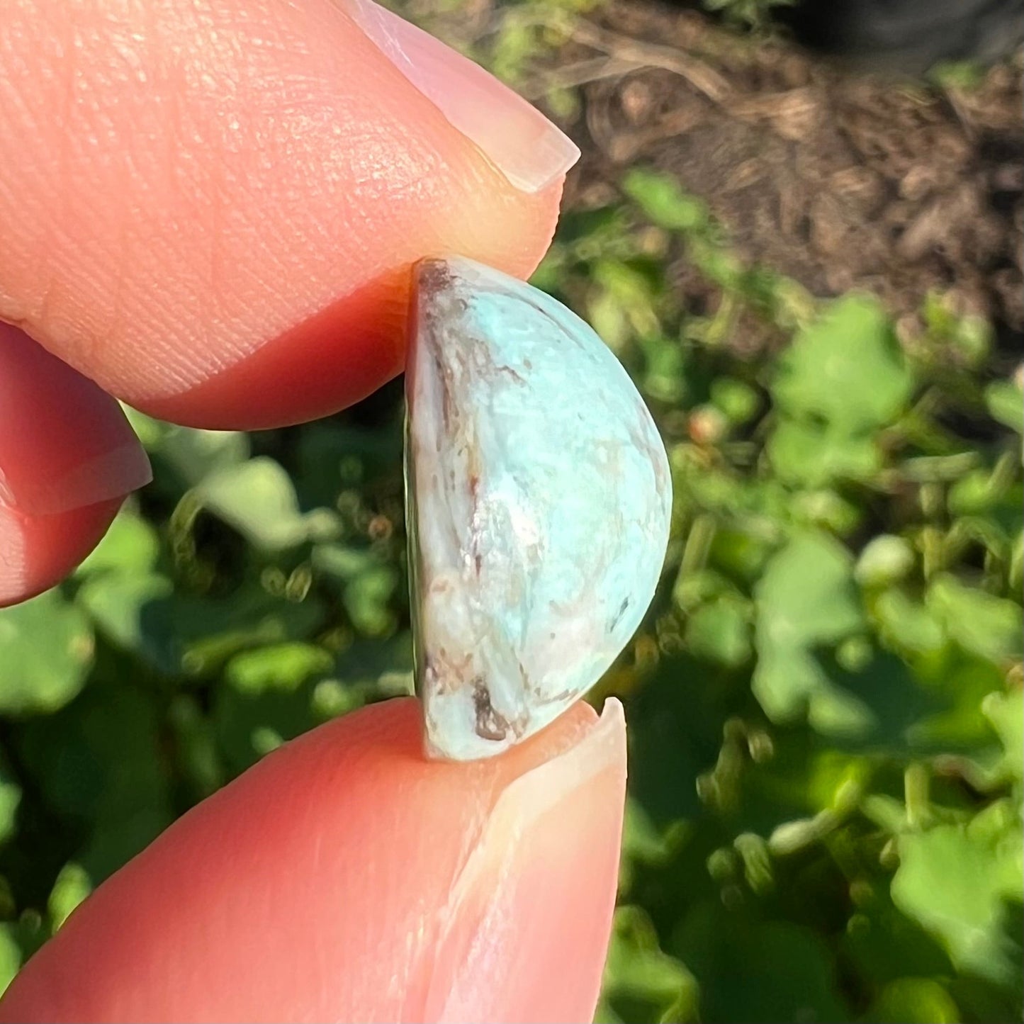 A loose, round cabochon cut Valley Blue turquoise stone.