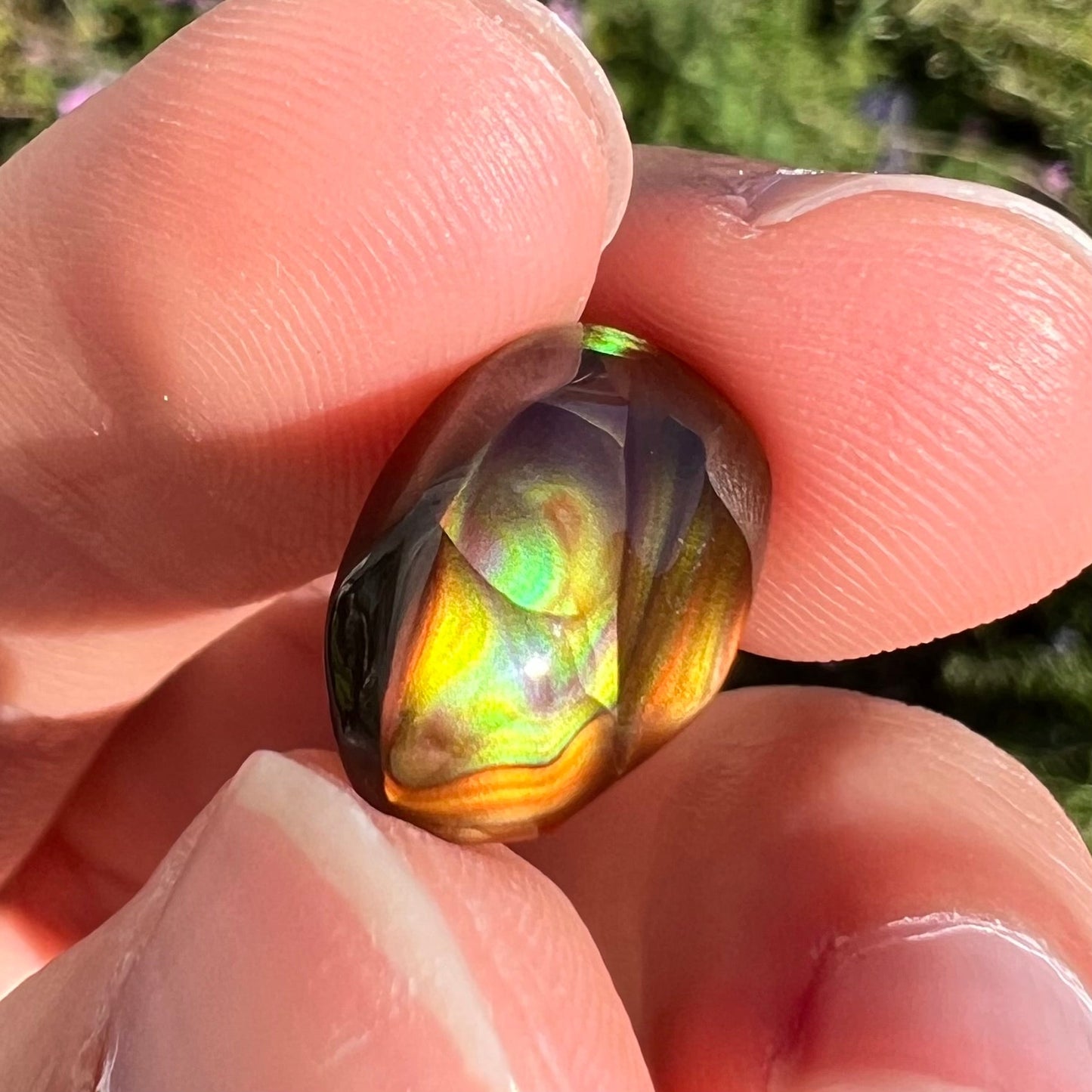 A loose, gem grade Mexican fire agate stone.  The stone is finely banded and ice blue green color.