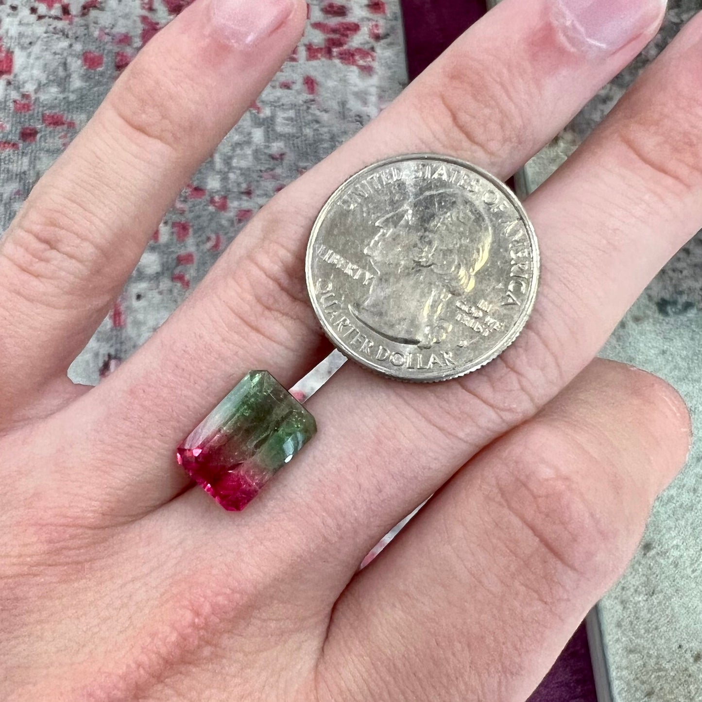 A loose pink and green emerald cut watermelon tourmaline gemstone.