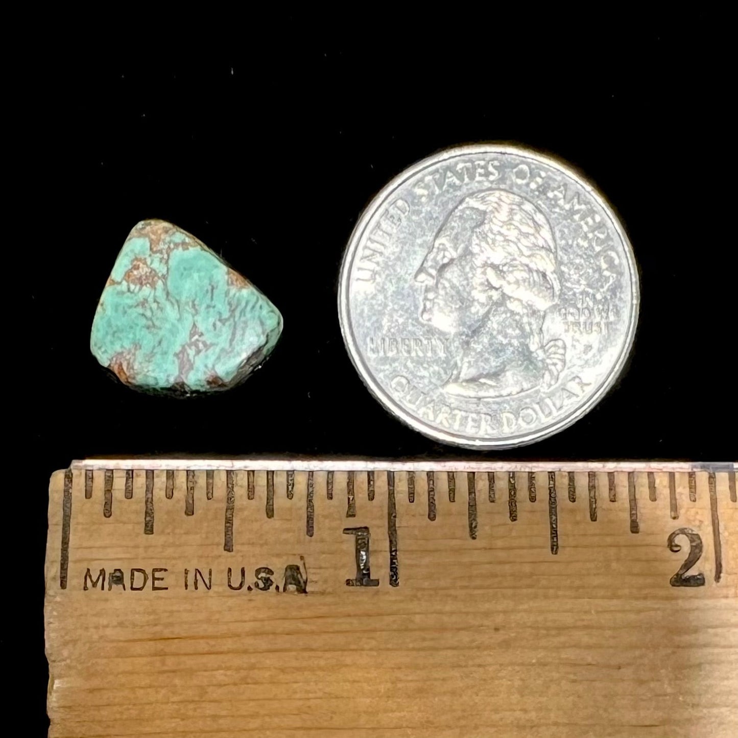 A loose greenish blue Royston turquoise stone from Nevada. The stone has brown matrix.