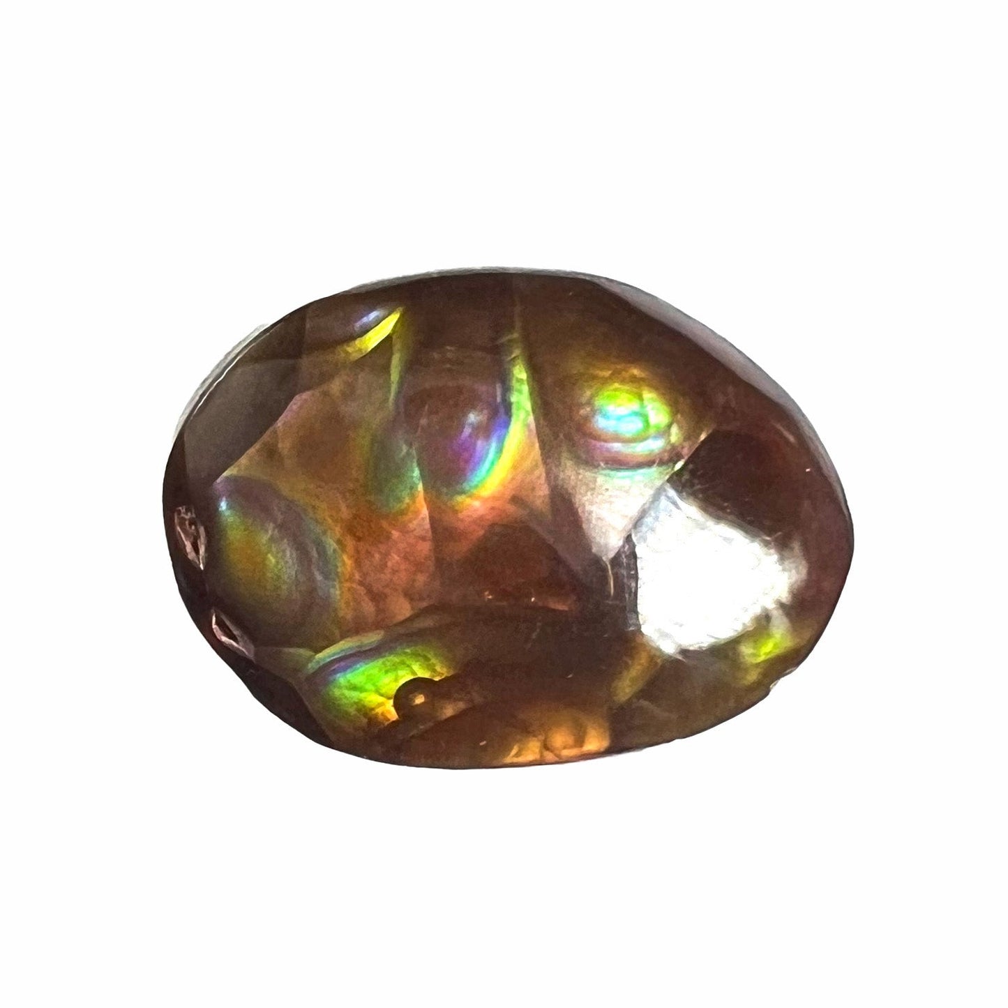 A loose, oval cabochon cut Mexican fire agate stone with pink, orange, and purple banding.