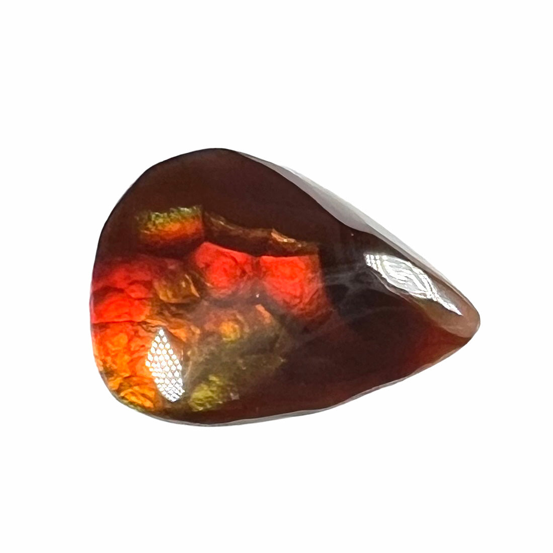 A loose, pear shaped Mexican fire agate gemstone. The stone is predominantly vivid red with green overtones.