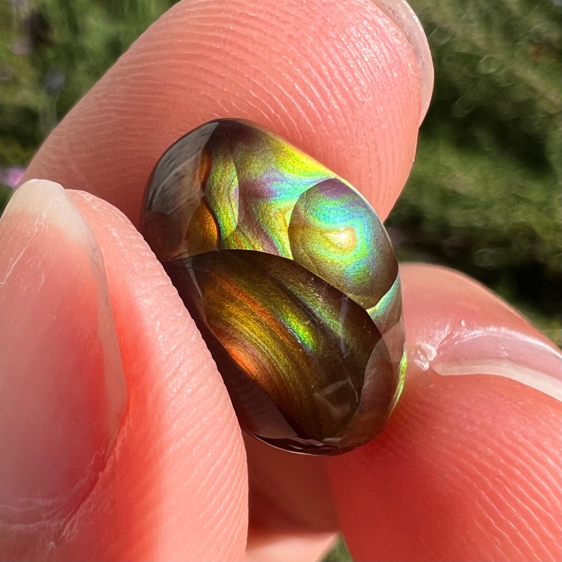 A loose, gem grade Mexican fire agate stone.  The stone is finely banded and ice blue green color.