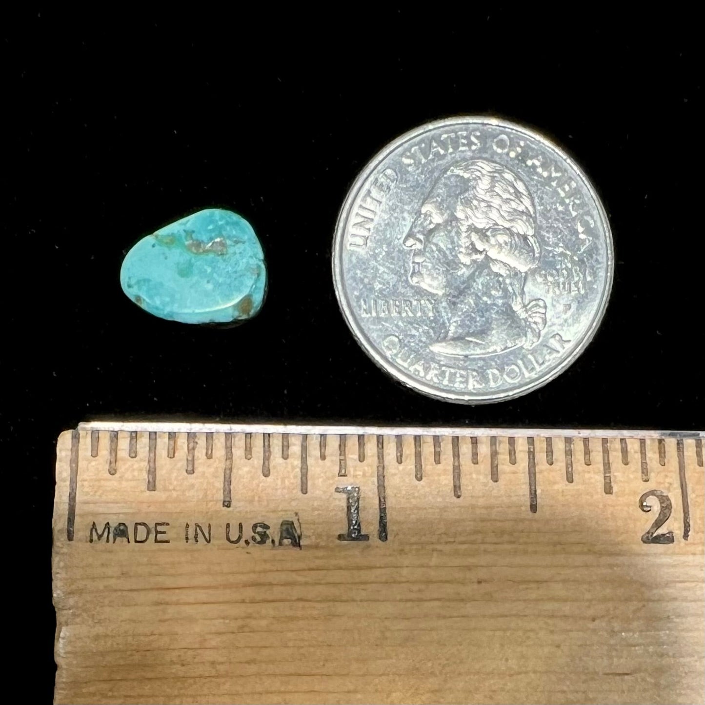 A loose, freeform pear shaped turquoise cabochon. The stone is from the Pilot Mountain Mine in Nevada.