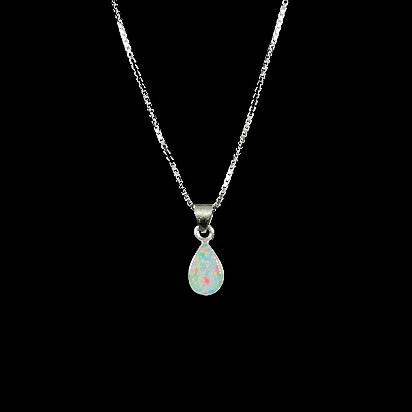 A pear shaped natural crystal opal necklace handmade in sterling silver.