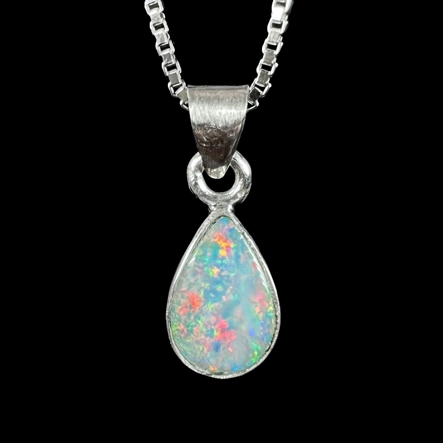 A pear shaped natural crystal opal necklace handmade in sterling silver.