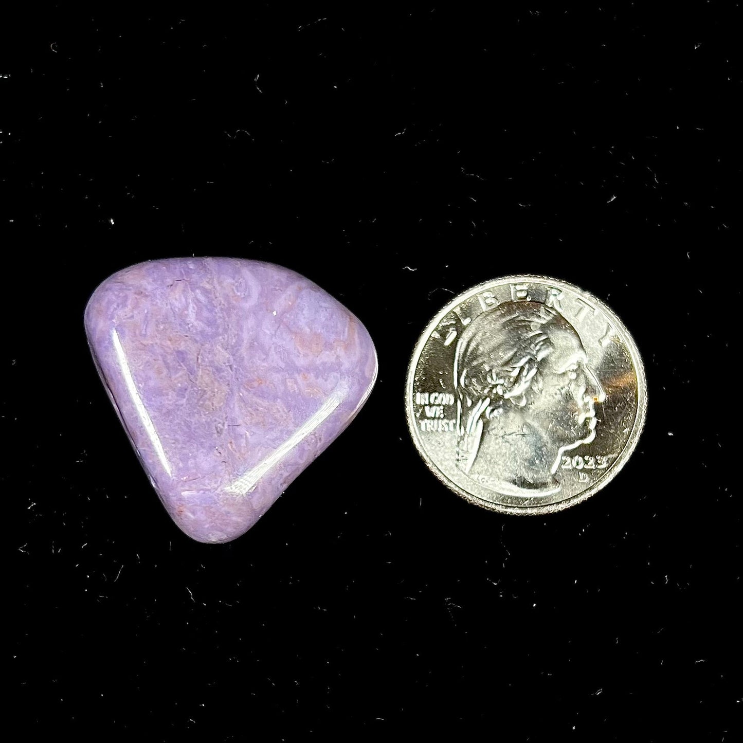 A tumble polished piece of purple turkiyenite jade stone. Material from Bursa, Turkey.