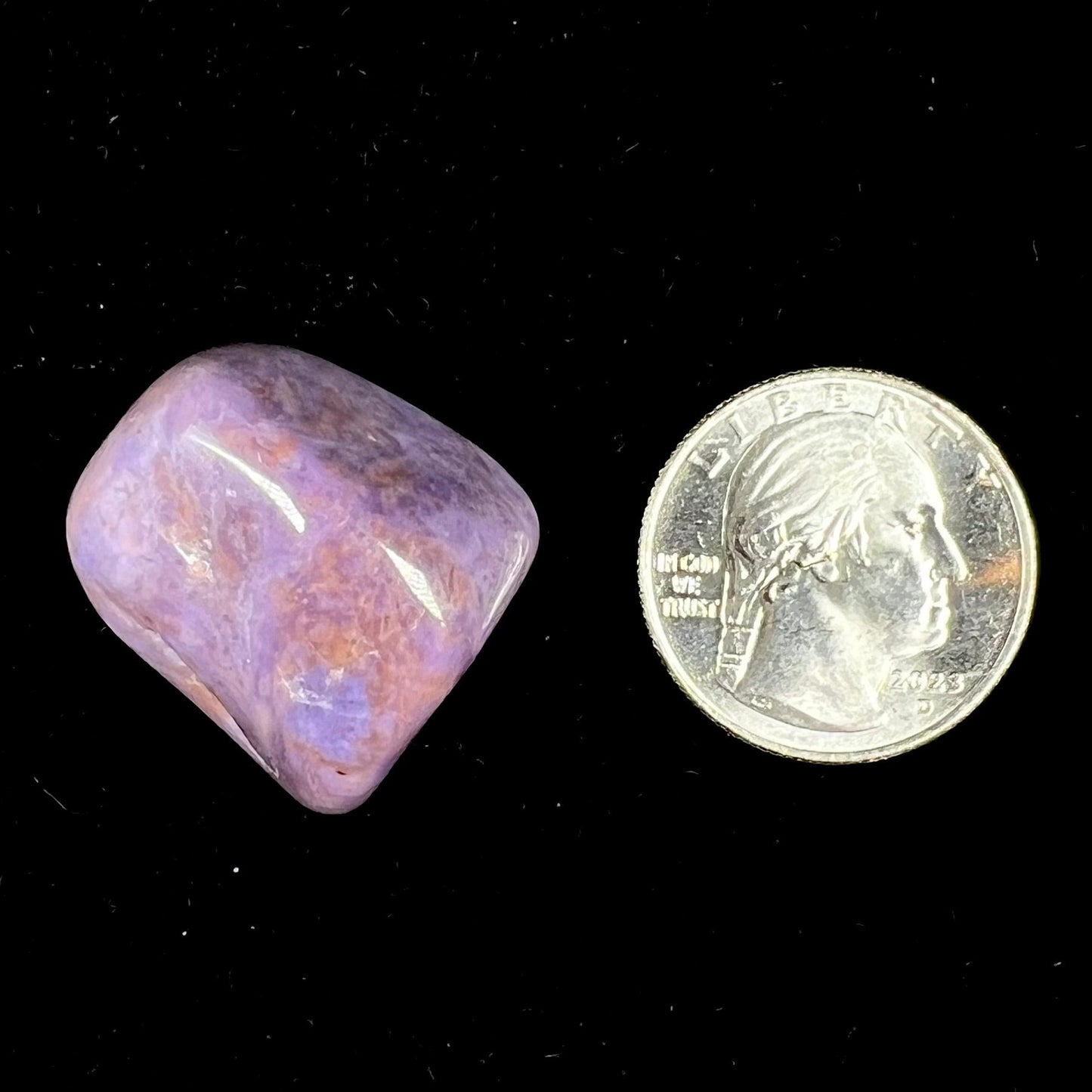 A tumble polished piece of purple turkiyenite jade stone. Material from Bursa, Turkey.