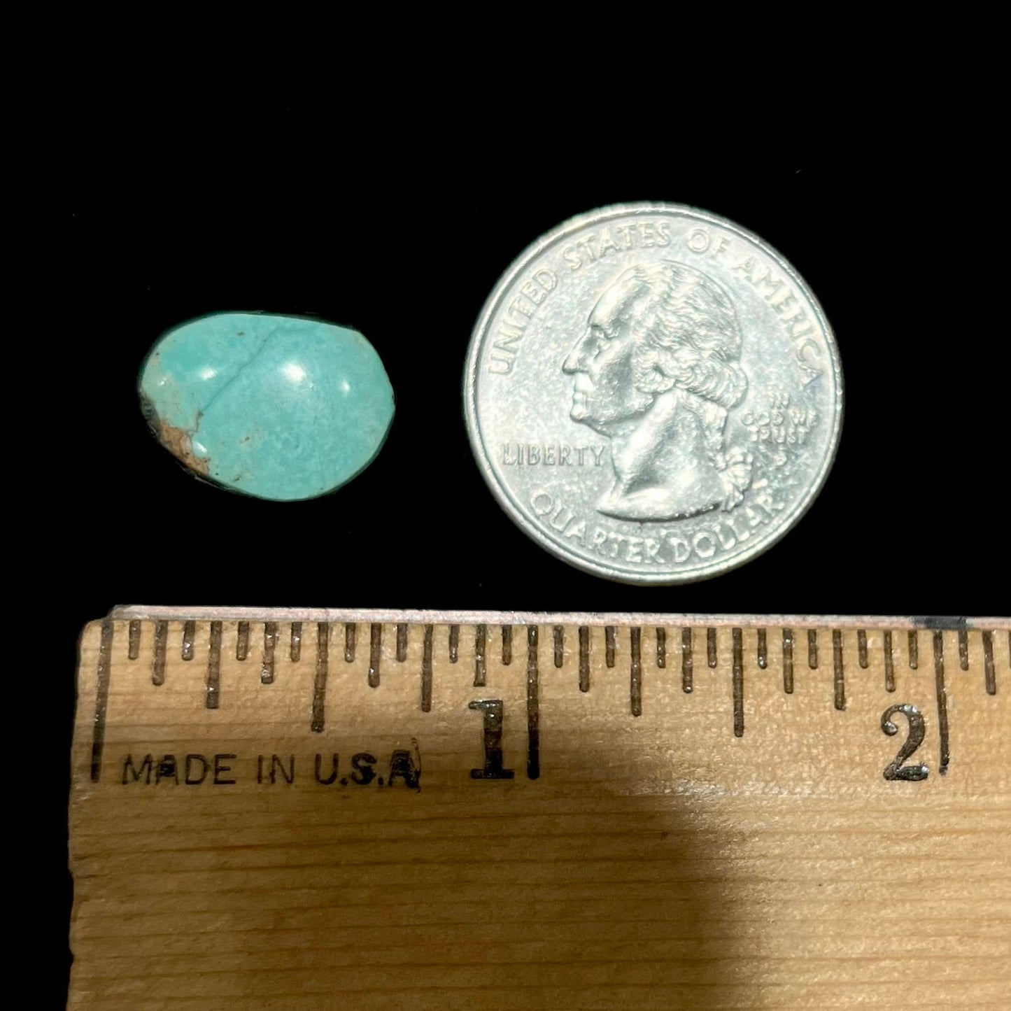 A loose, green Royston turquoise stone from Nevada. The stone is a freeform cabochon cut.
