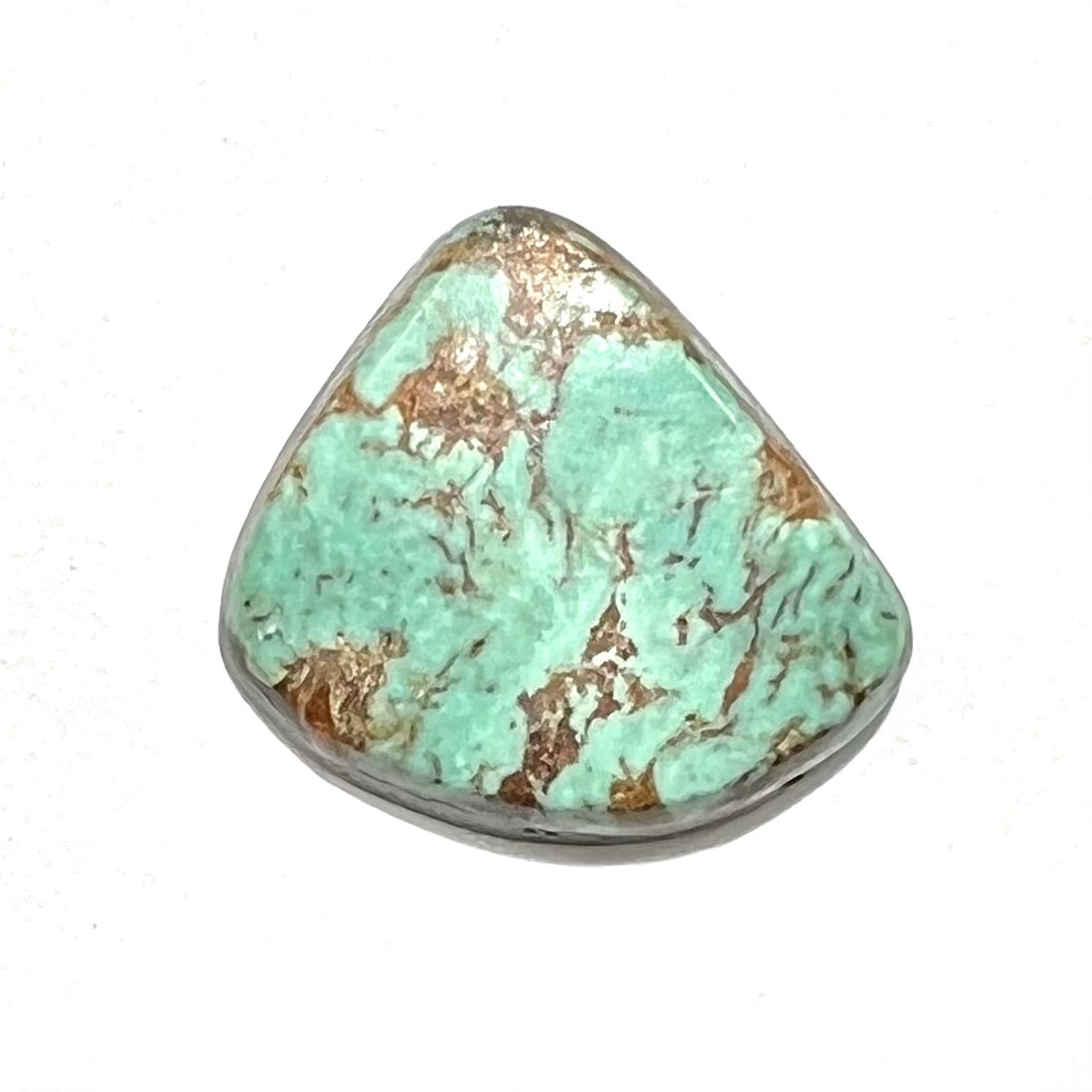 A loose greenish blue Royston turquoise stone from Nevada. The stone has brown matrix.
