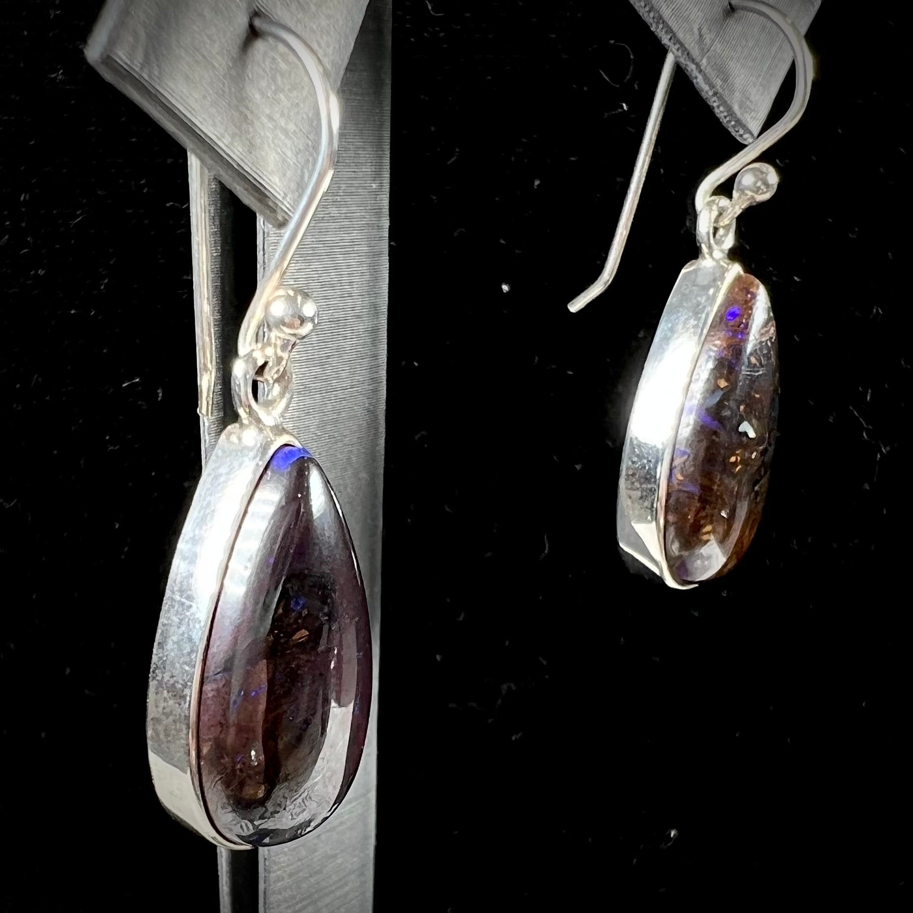 A pair of handmade sterling silver boulder opal French wire dangle earrings.  We named them Ryan and Harris.