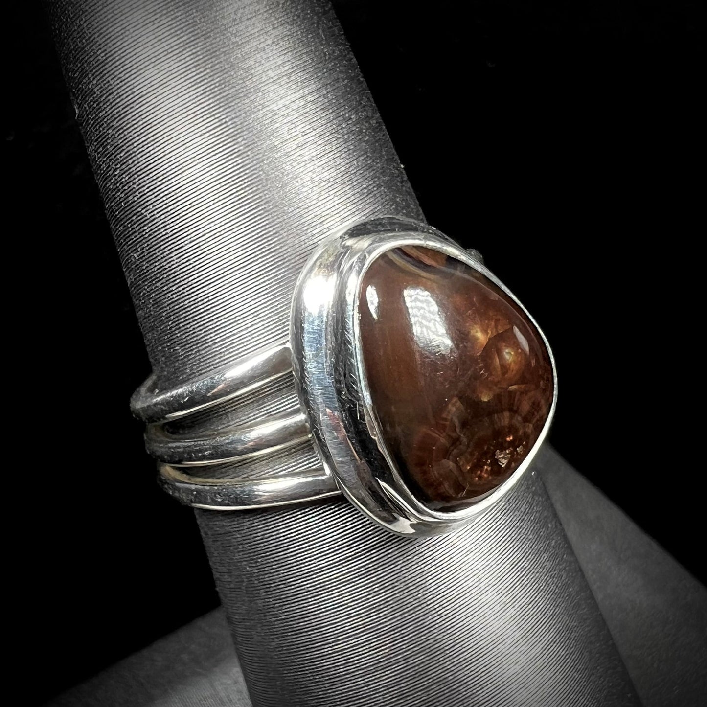 A ladies' fire agate ring set in a split-shank sterling silver mounting.