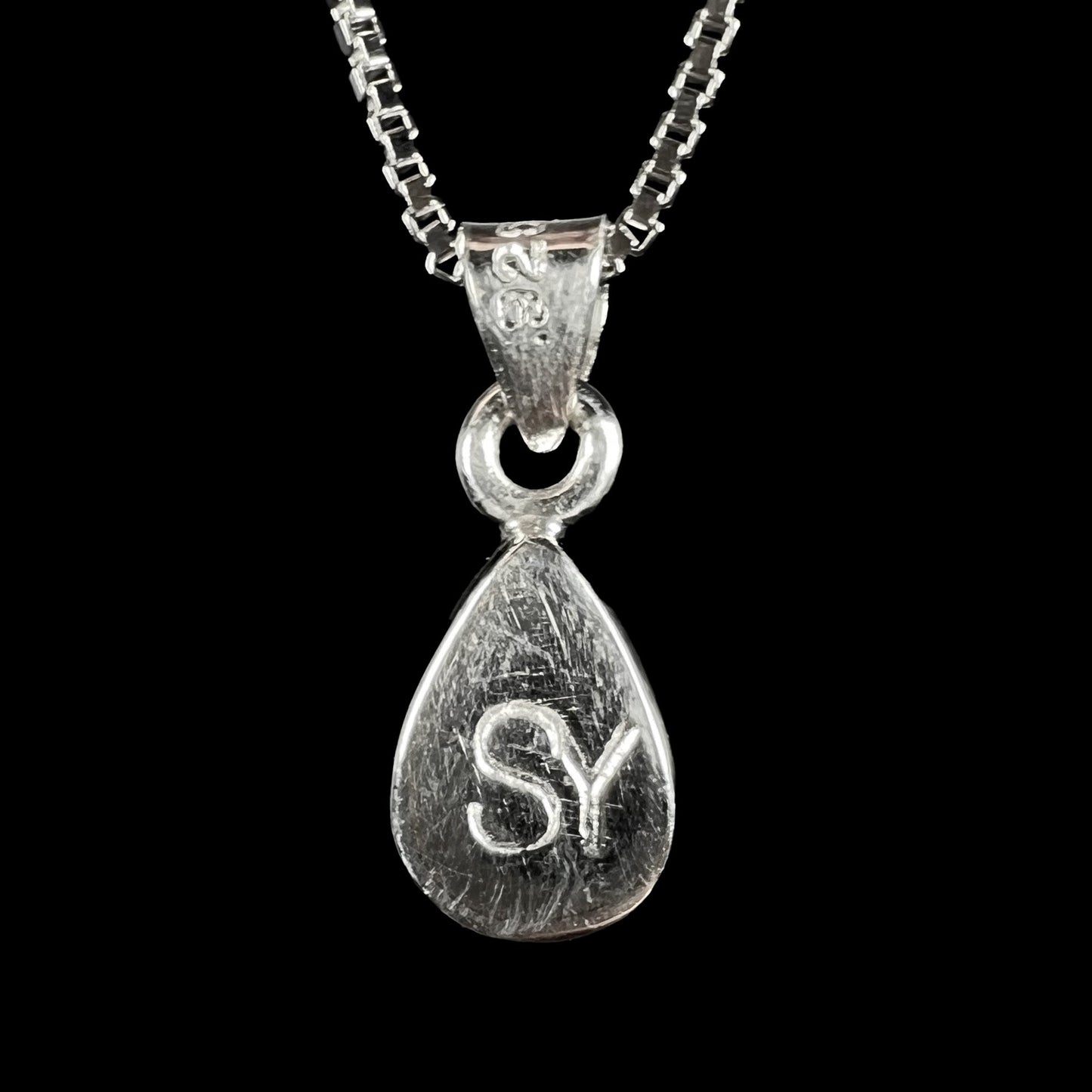 A pear shaped natural crystal opal necklace handmade in sterling silver.