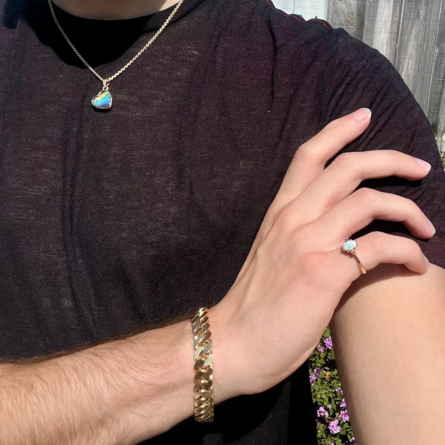A dainty, 1960's style opal and diamond engagement ring. The ring is prong-set and yellow gold.