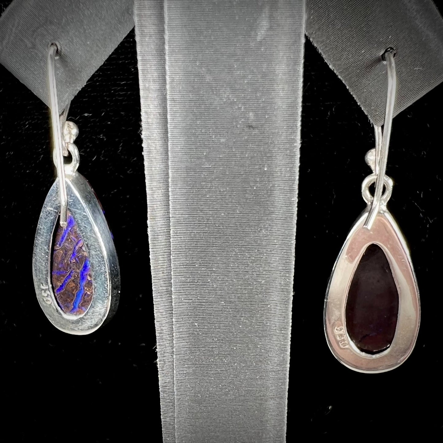 A pair of handmade sterling silver boulder opal French wire dangle earrings.  We named them Ryan and Harris.