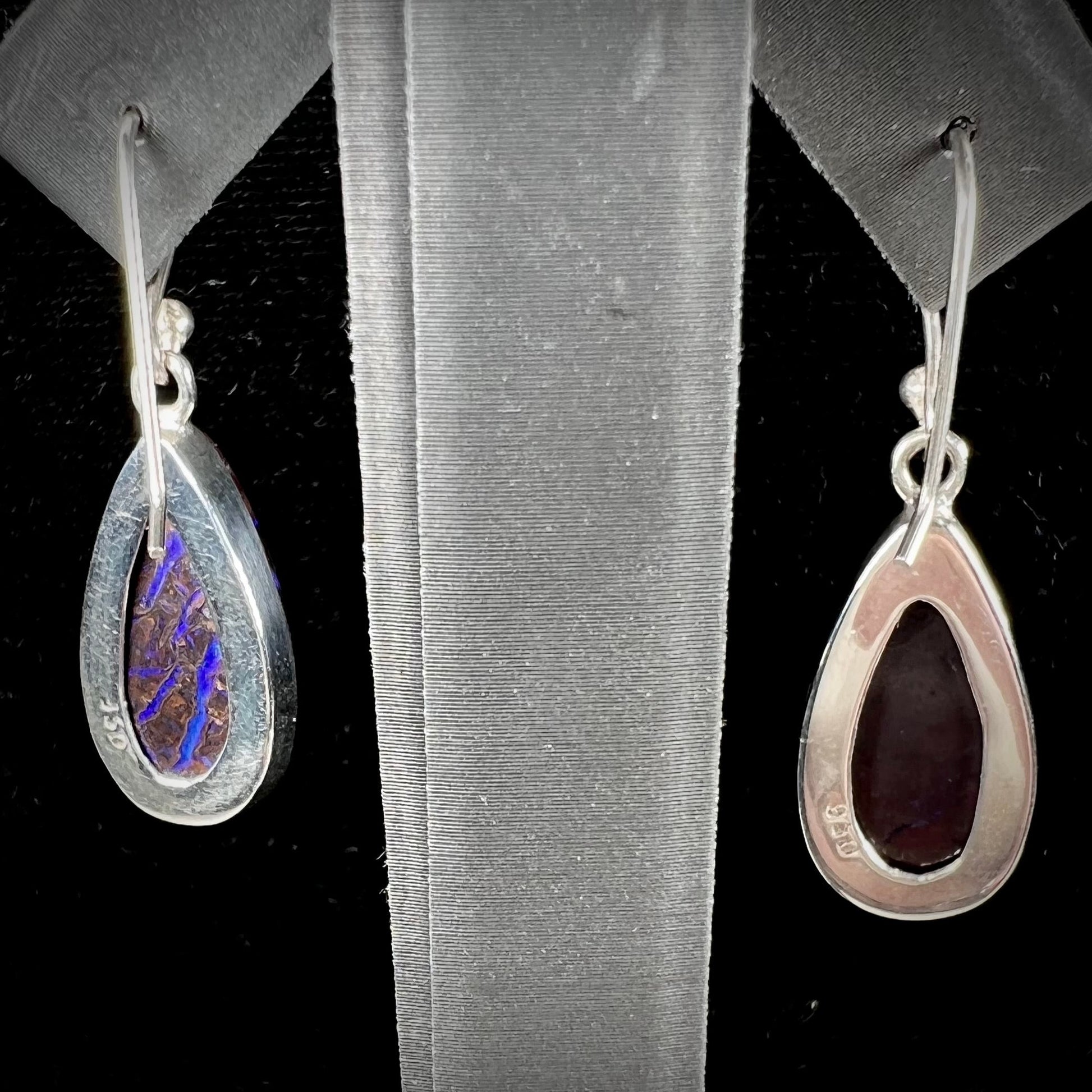 A pair of handmade sterling silver boulder opal French wire dangle earrings.  We named them Ryan and Harris.