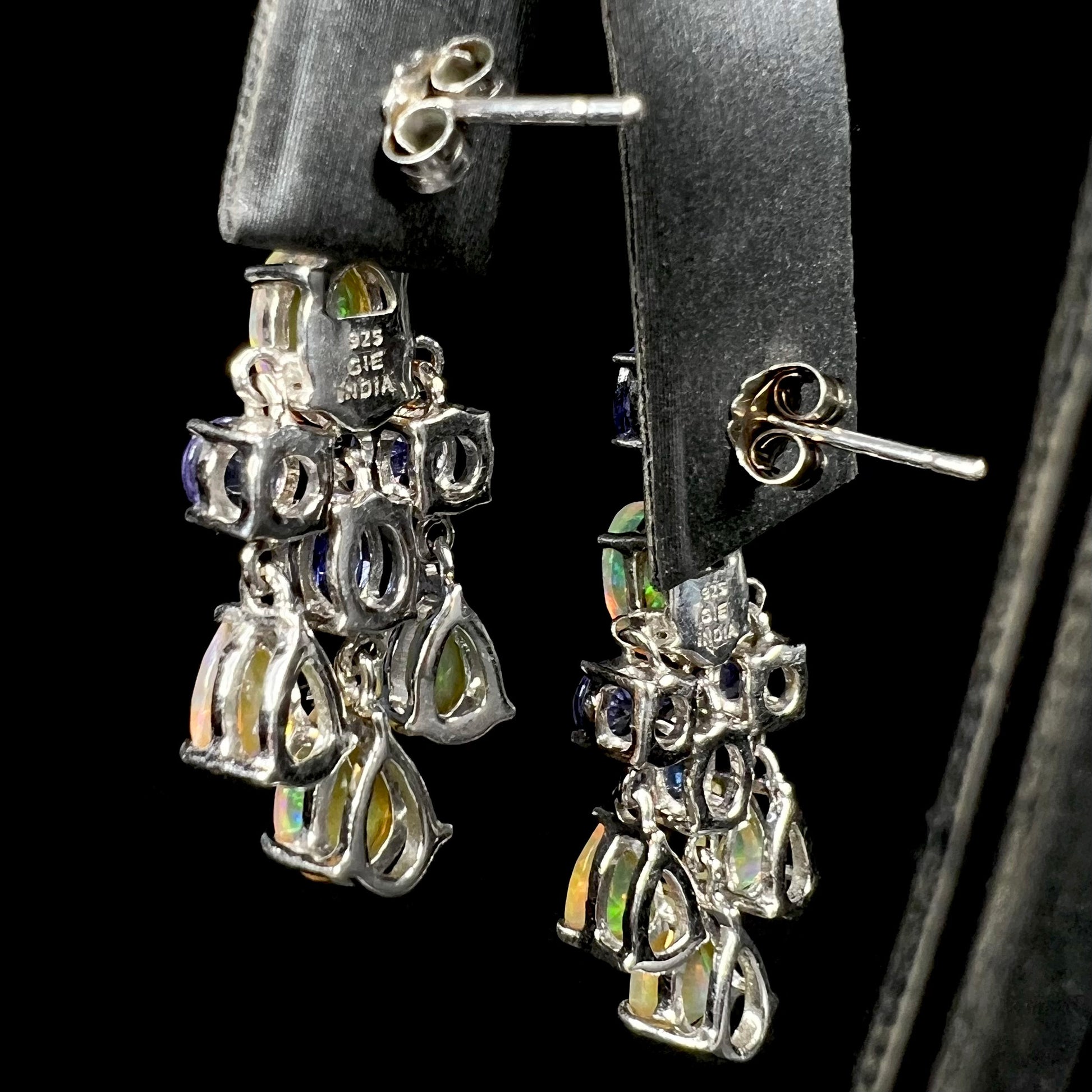 Back of a pair of sterling silver Ethiopian opal and tanzanite chandelier earrings.
