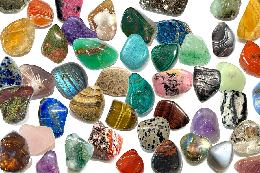 Collection of various colorful tumbled stones.