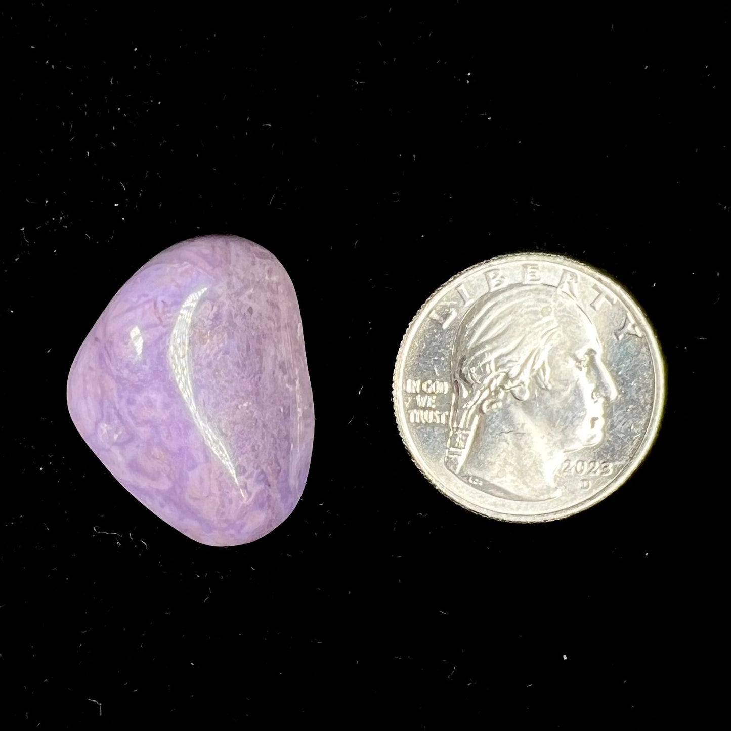 A rounded, tumbled piece of purple turkiyenite jade. Bursa, Turkish material.