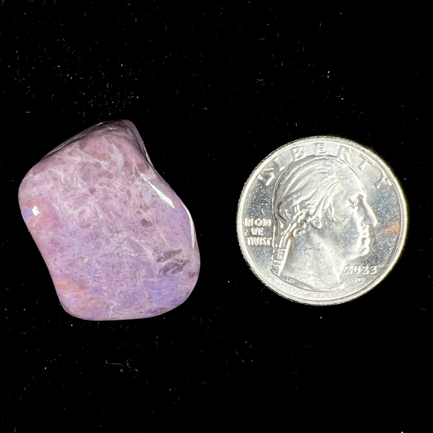 A piece of natural, tumbled purple turkiyenite jade. Material from Turkey.