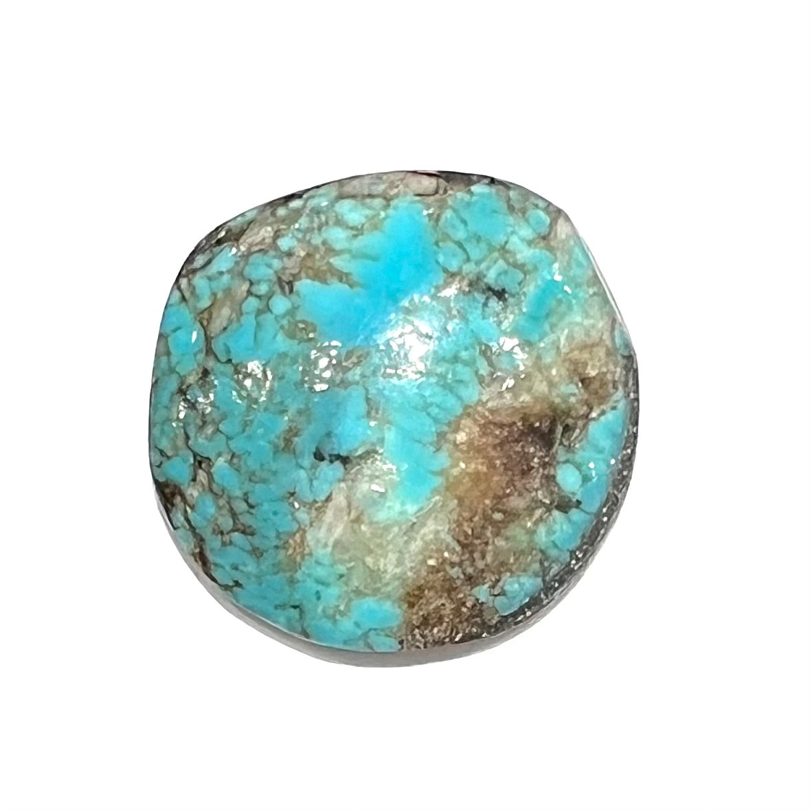 A round cabochon cut Tyrone turquoise stone from New Mexico. The stone is blue with brown, gray, and black matrix.