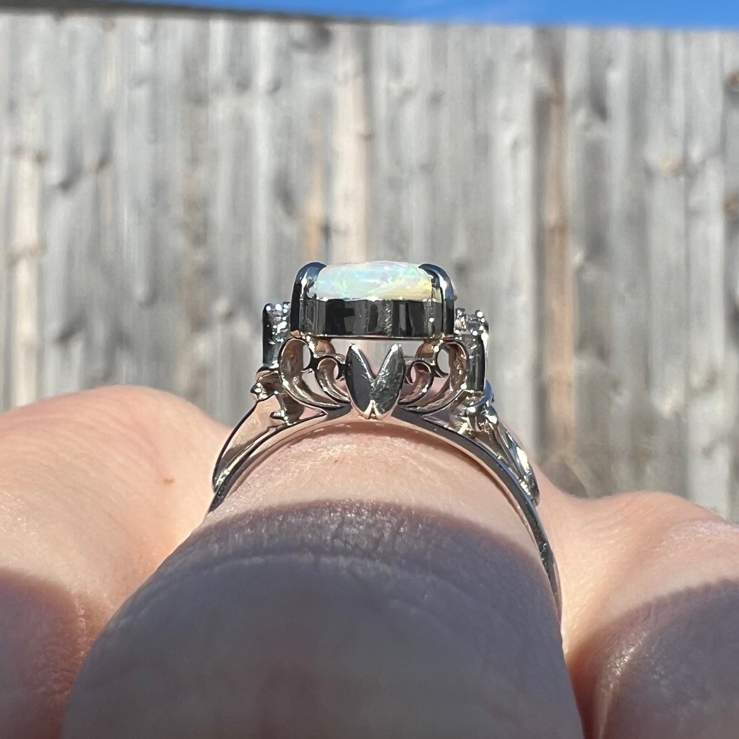 A nature-inspired platinum opal ring. Diamond accents line the sides of the 2.35ct opal.