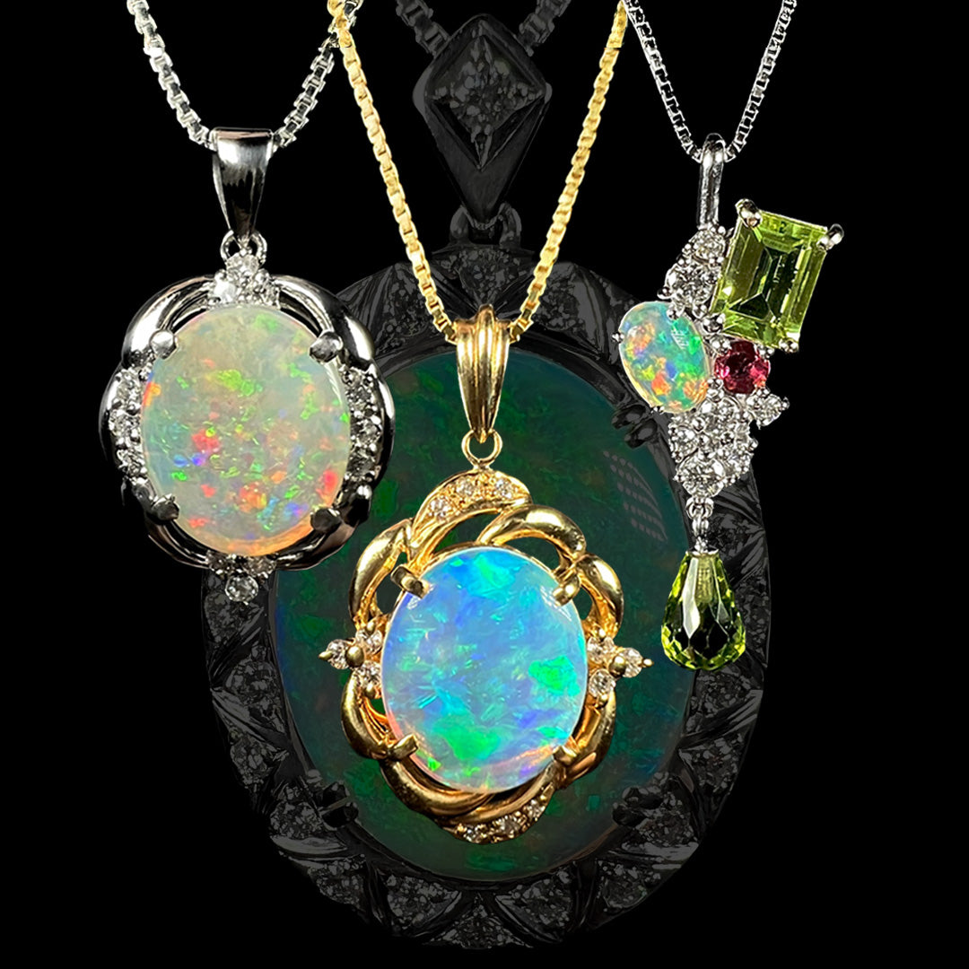Three Japanese-crafted Australian opal and diamond necklaces—one platinum, one gold, and one white gold with gemstones—shown in front of the silhouette of a larger Art Deco-inspired opal and diamond pendant.