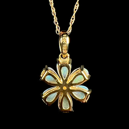 Back side of yellow gold opal flower design pendant, the back of the bail stamped "10K" and "IBJ"